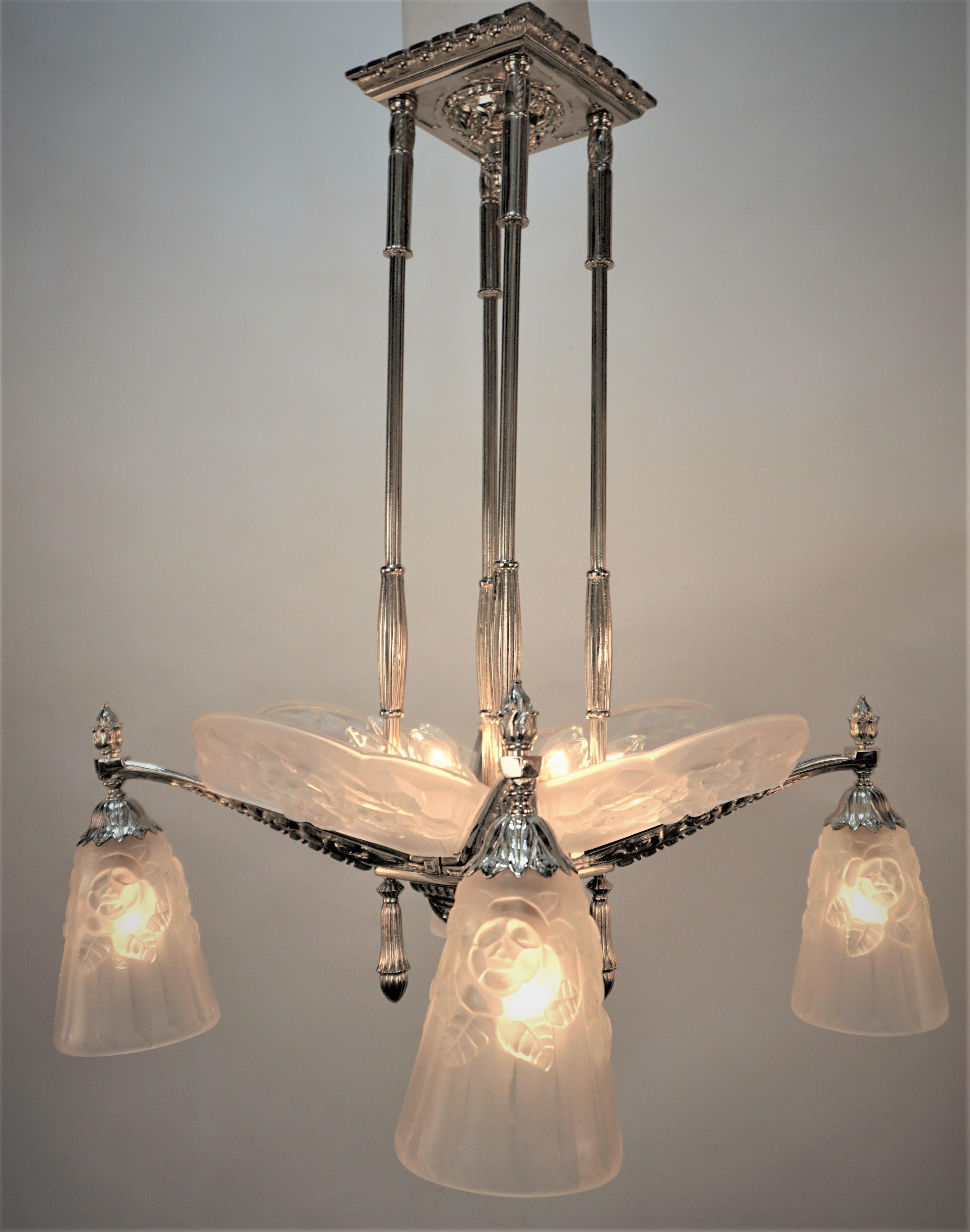 Elegant clear frost glass with nickel on bronze frame Art deco chandelier.
twelve lights 60watts max each. 
Professionally rewired and ready for installation.
Measurement: width 18.5