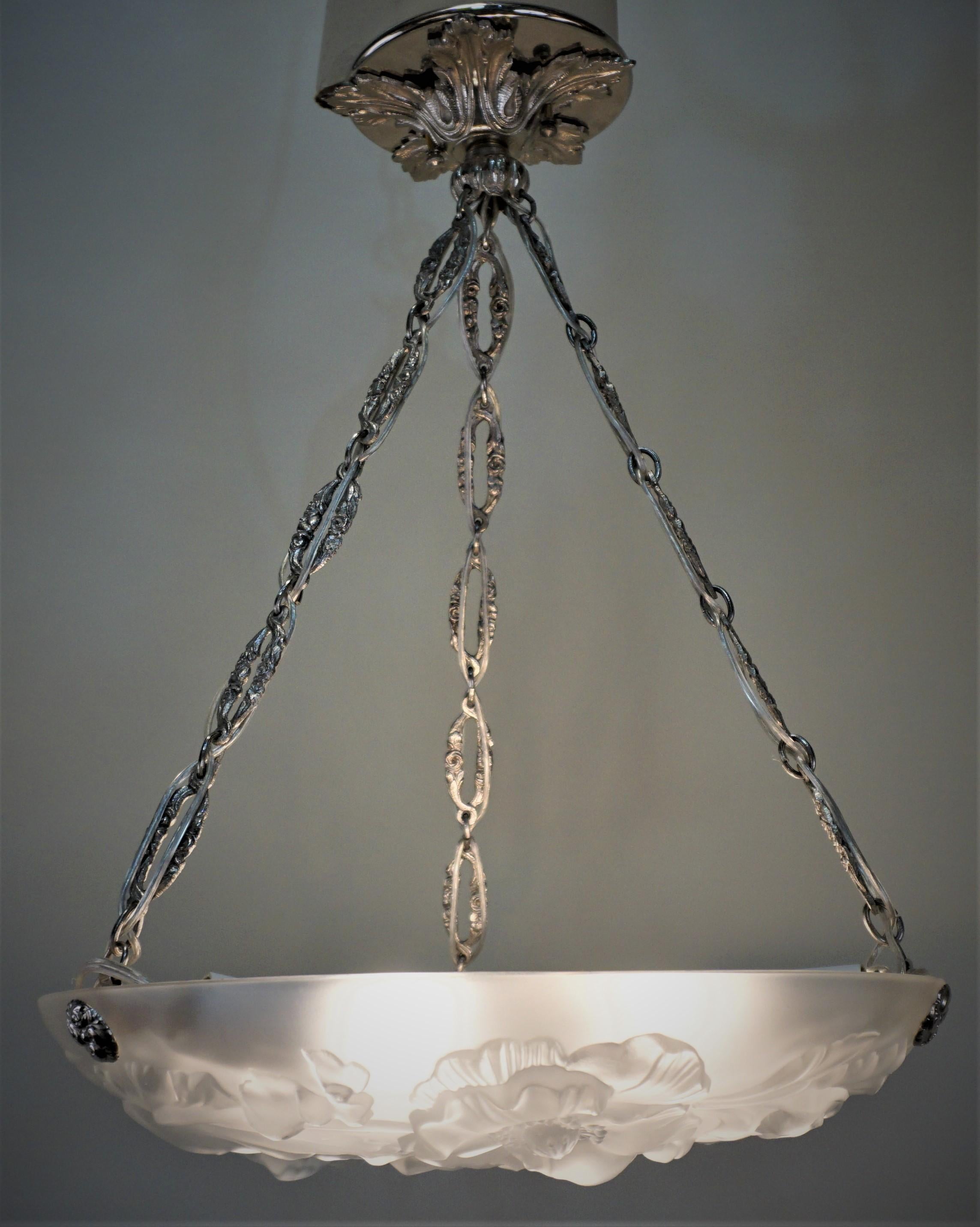 Beautiful 1920s clear frost color glass nickel on bronze hardware chandelier.
Six-light 60 watts max each.