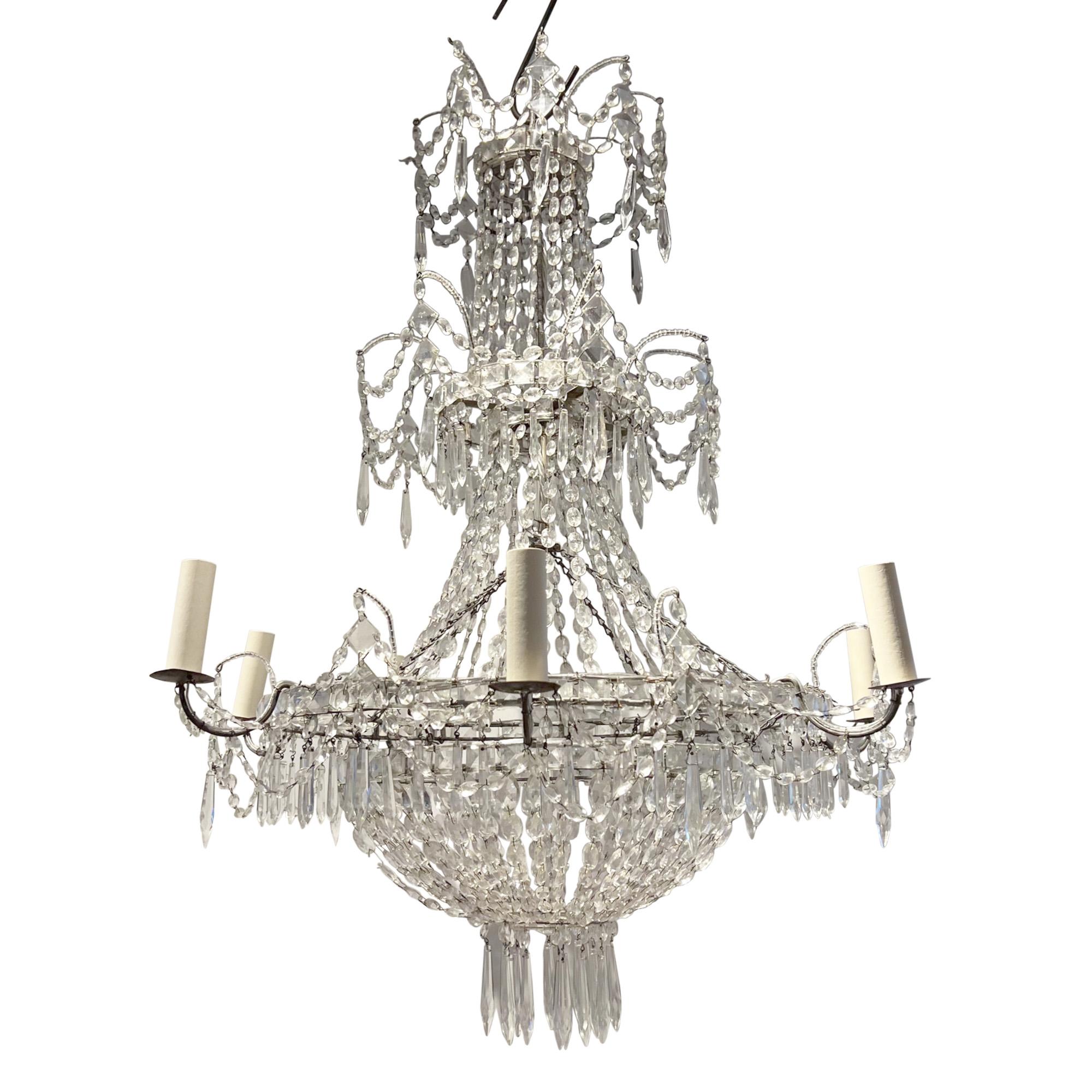 This is a really spectacular chandelier.

Made in France in the 1920s - it has an intricately strung beaded design. Take a look at all our pictures to see the detail.

With 7 arms, this would be a lovely light for any room in the house. 

This