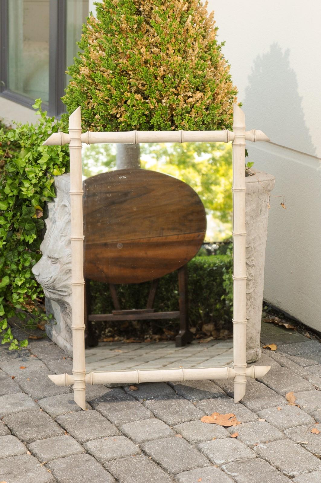 A French faux-bamboo rectangular mirror from the early 20th century, with bleached finish. Born in France during the 