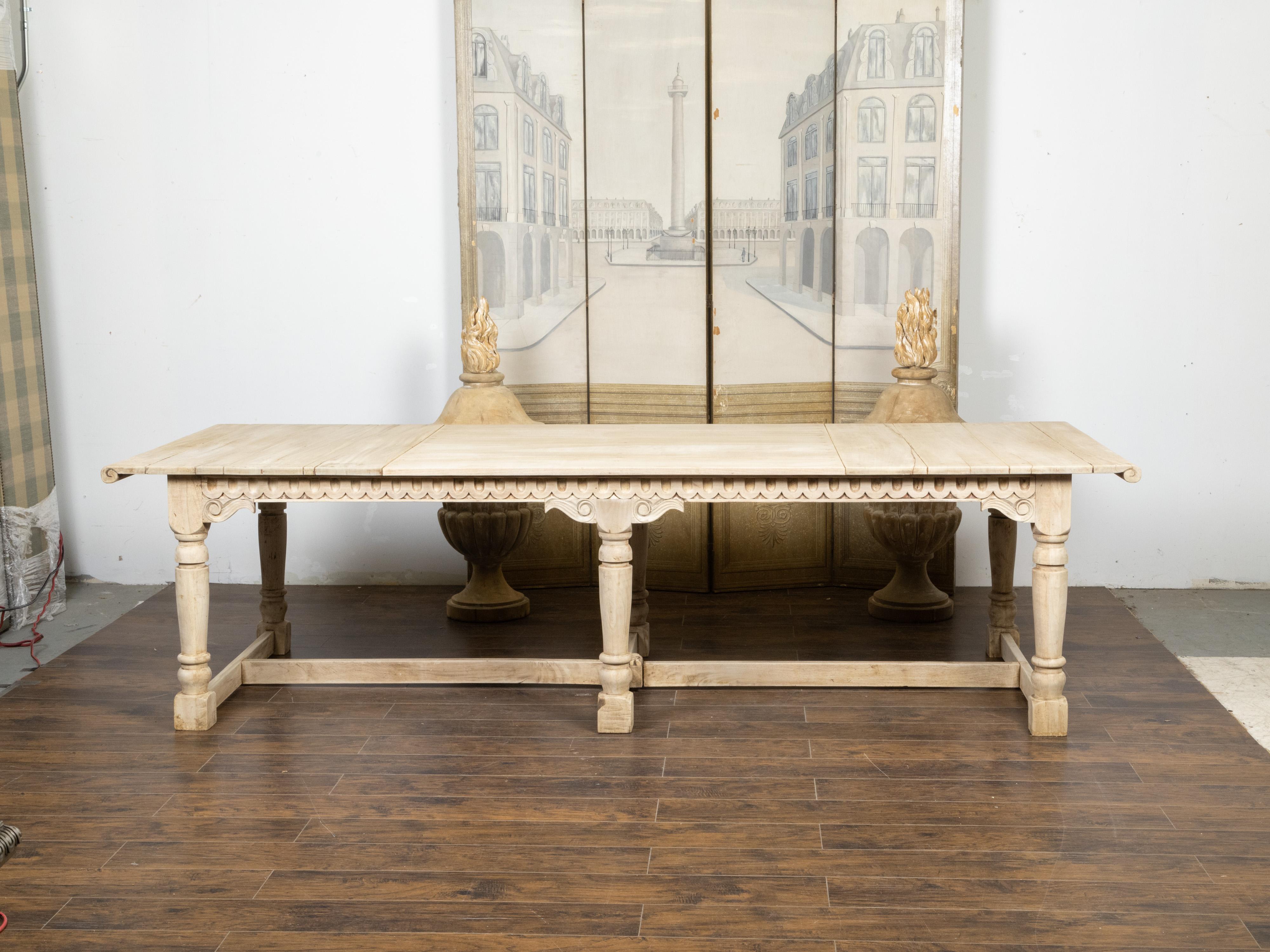 20th Century French, 1920s, Bleached Walnut Dining Table with Carved Apron and Scrolling Top For Sale