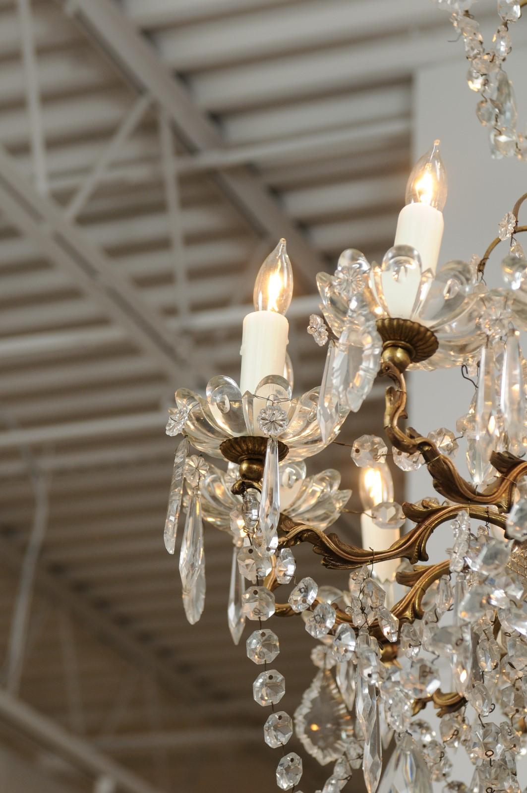French 1920s Brass and Crystal Twelve-Light Chandelier with Scrolled Arms 1