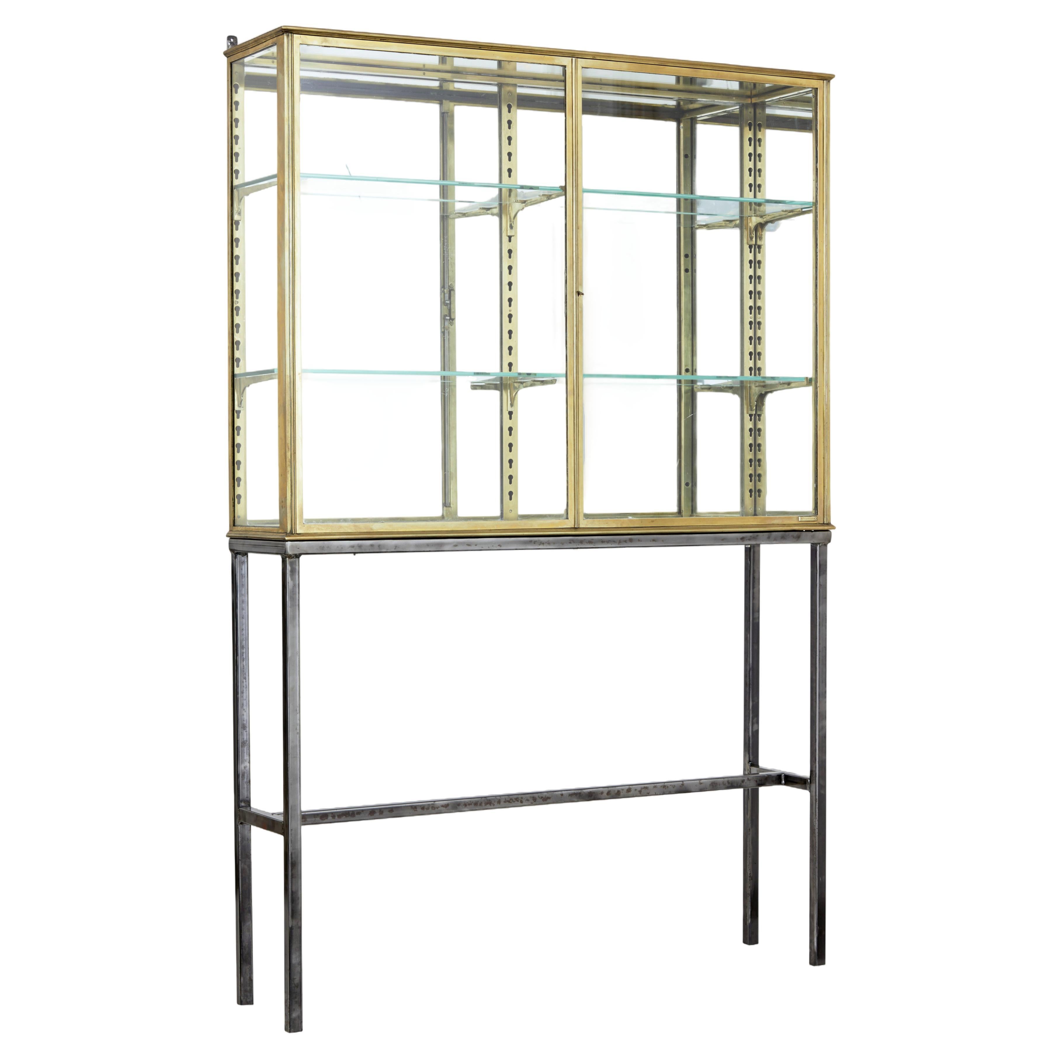 French 1920’s brass glazed shop display cabinet by Segel For Sale