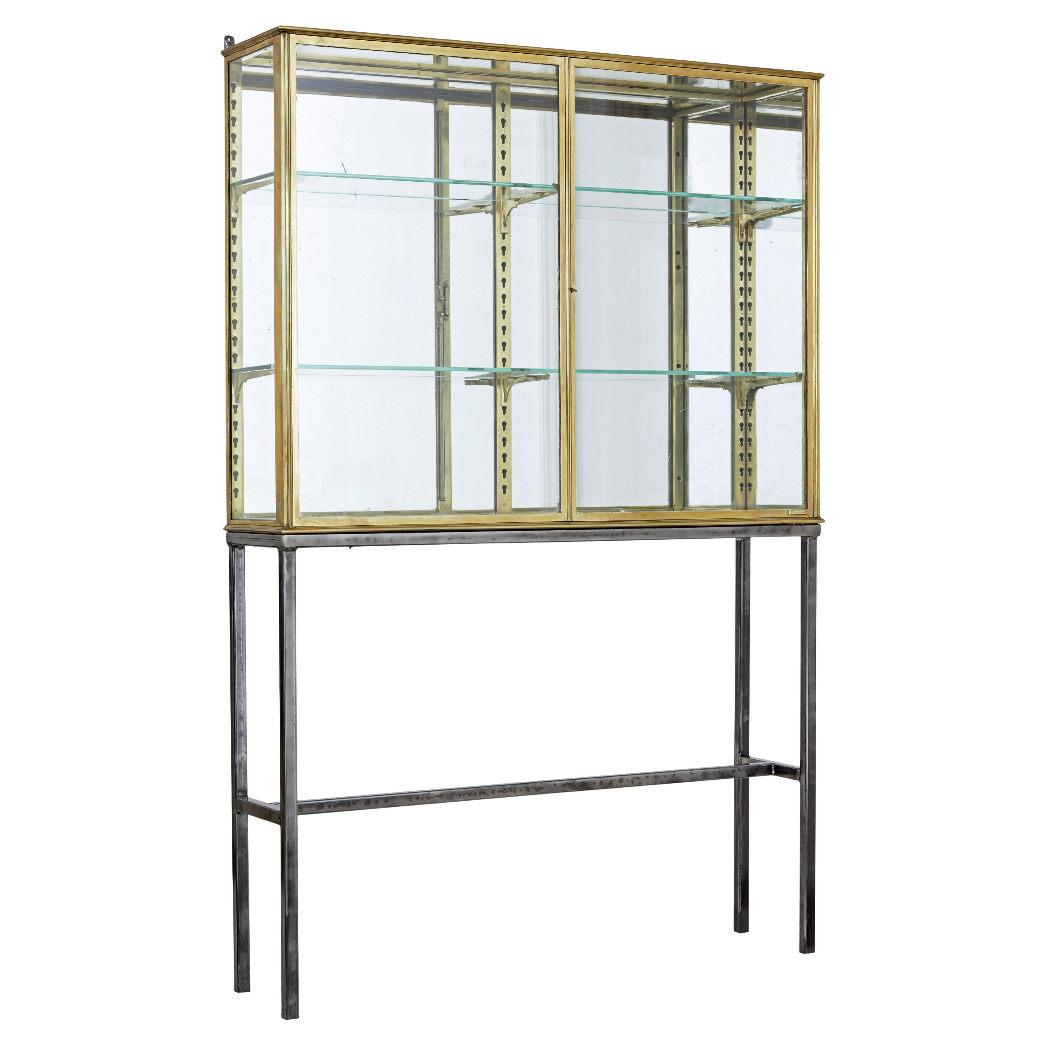 French 1920’s brass glazed shop display cabinet by Siegel For Sale