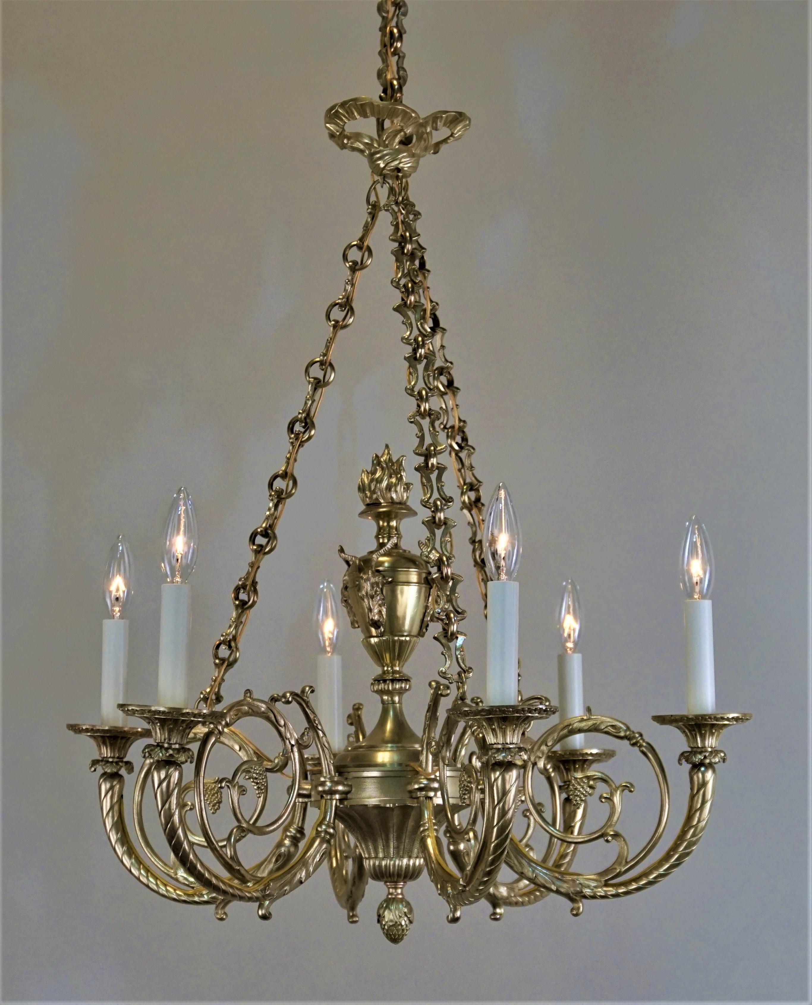 Elegant six-arm 1920s French bronze chandelier with goat heads center design.