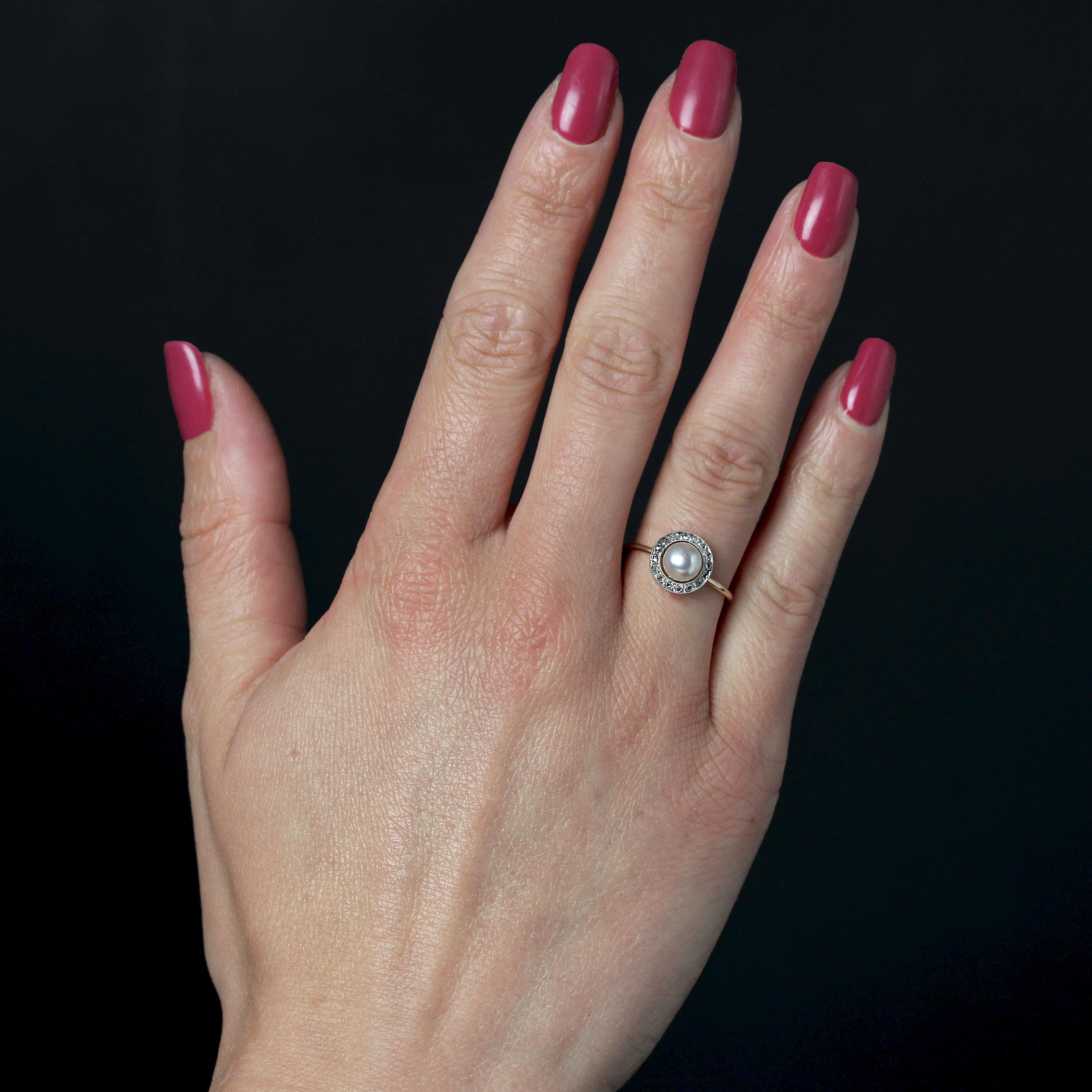 Ring in 18 Karats yellow gold, eagle head hallmark.
A charming round antique ring set with small rose-cut diamonds. In the center, a round white orient cultured pearl is set. The ring is a round wire.
Diameter of the pearl : 6/6,5 mm approximately.
