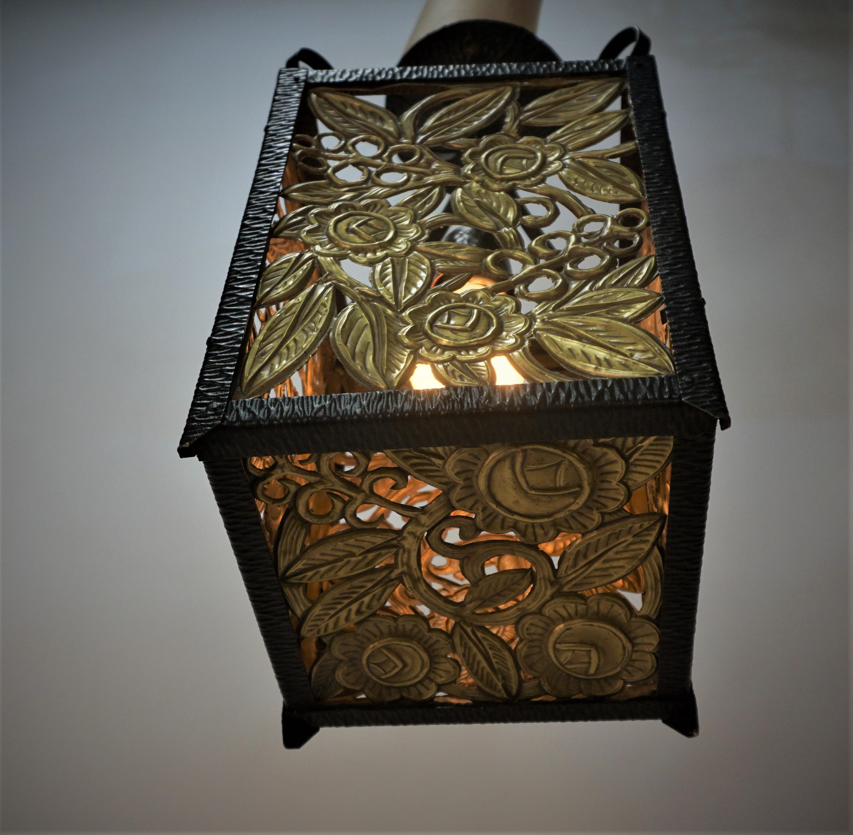 Beautiful hand crafted 1920's French lantern with tamped cut out brass panels in square iron frame.