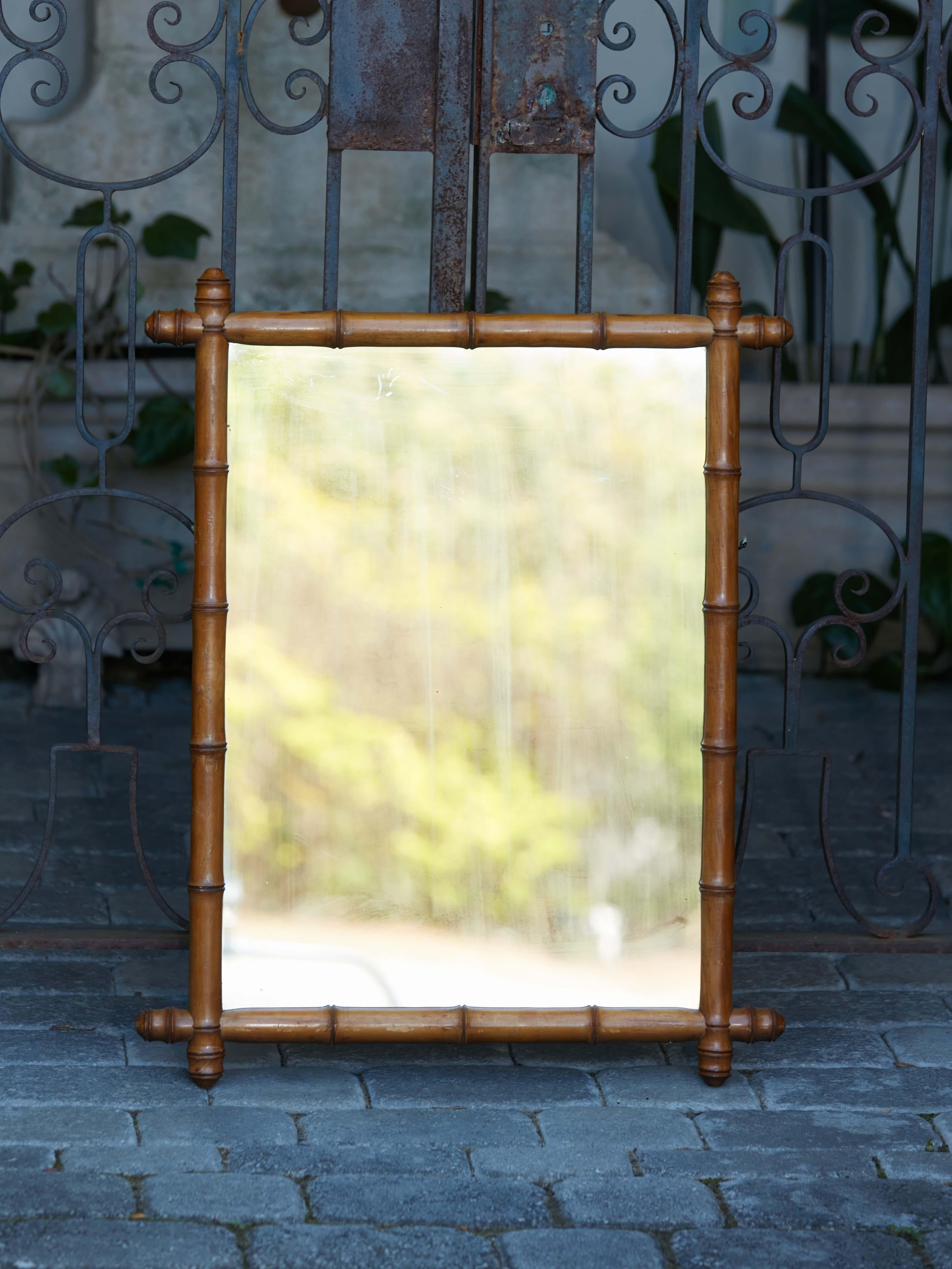 Rustic French 1920s Faux Bamboo Walnut Mirror with Protruding Corners and Brown Patina For Sale