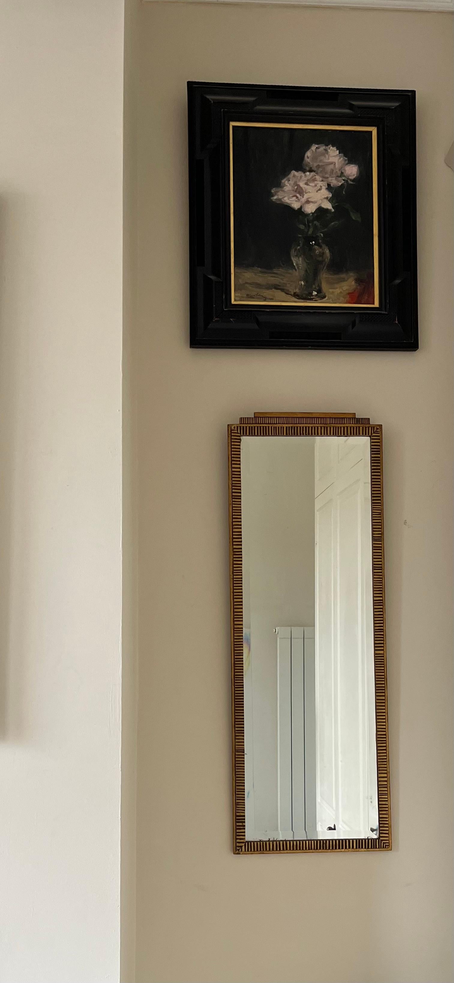 Élégant French 1920’s gilded wrought iron pier mirror with original bevelled edge glass. Reminiscent of Edgar Brandt.