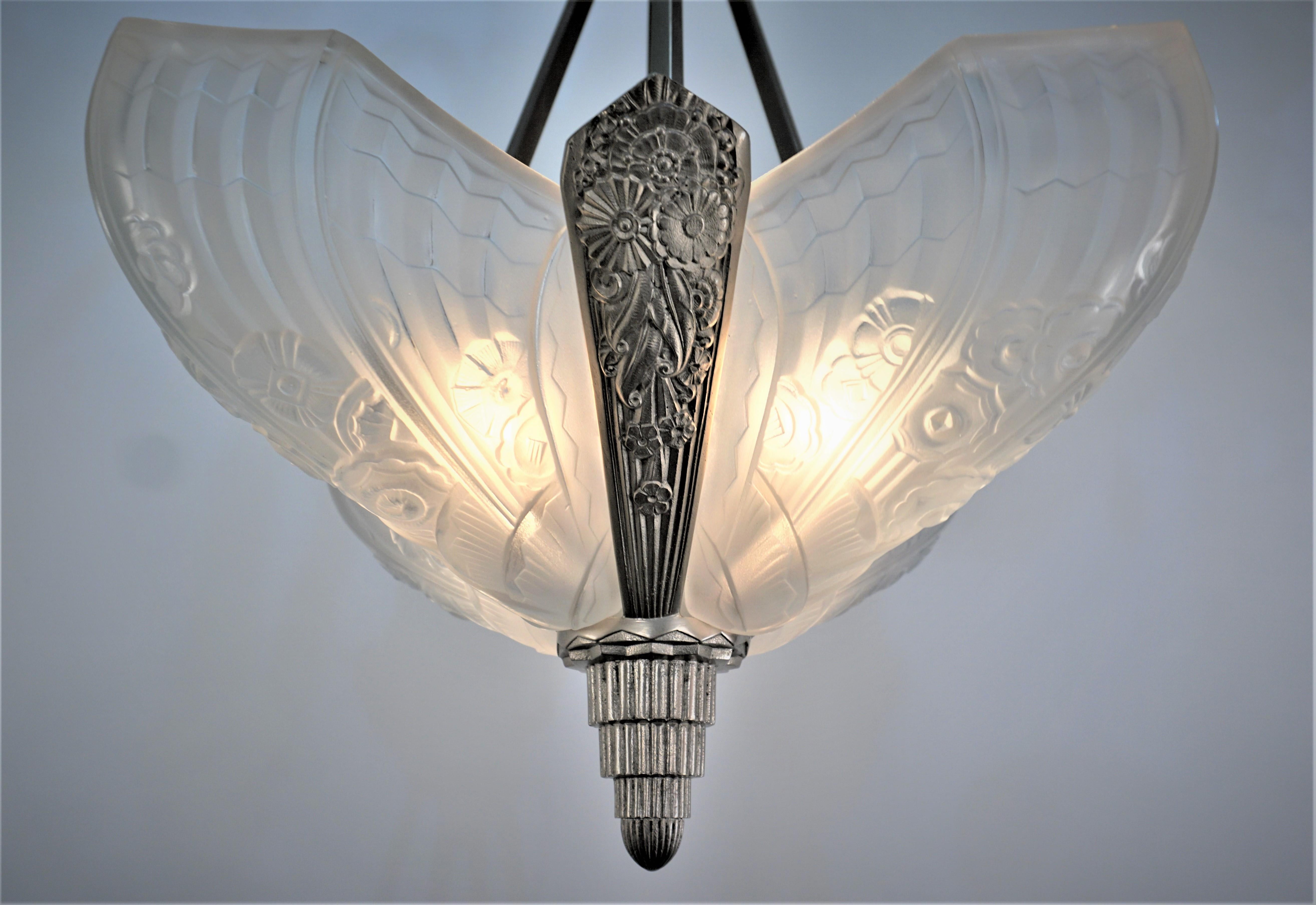 French 1920's four panel clear frost glass with same design nickel on bronze frame chandelier.
This chandelier is professionally rewired and ready for installation.