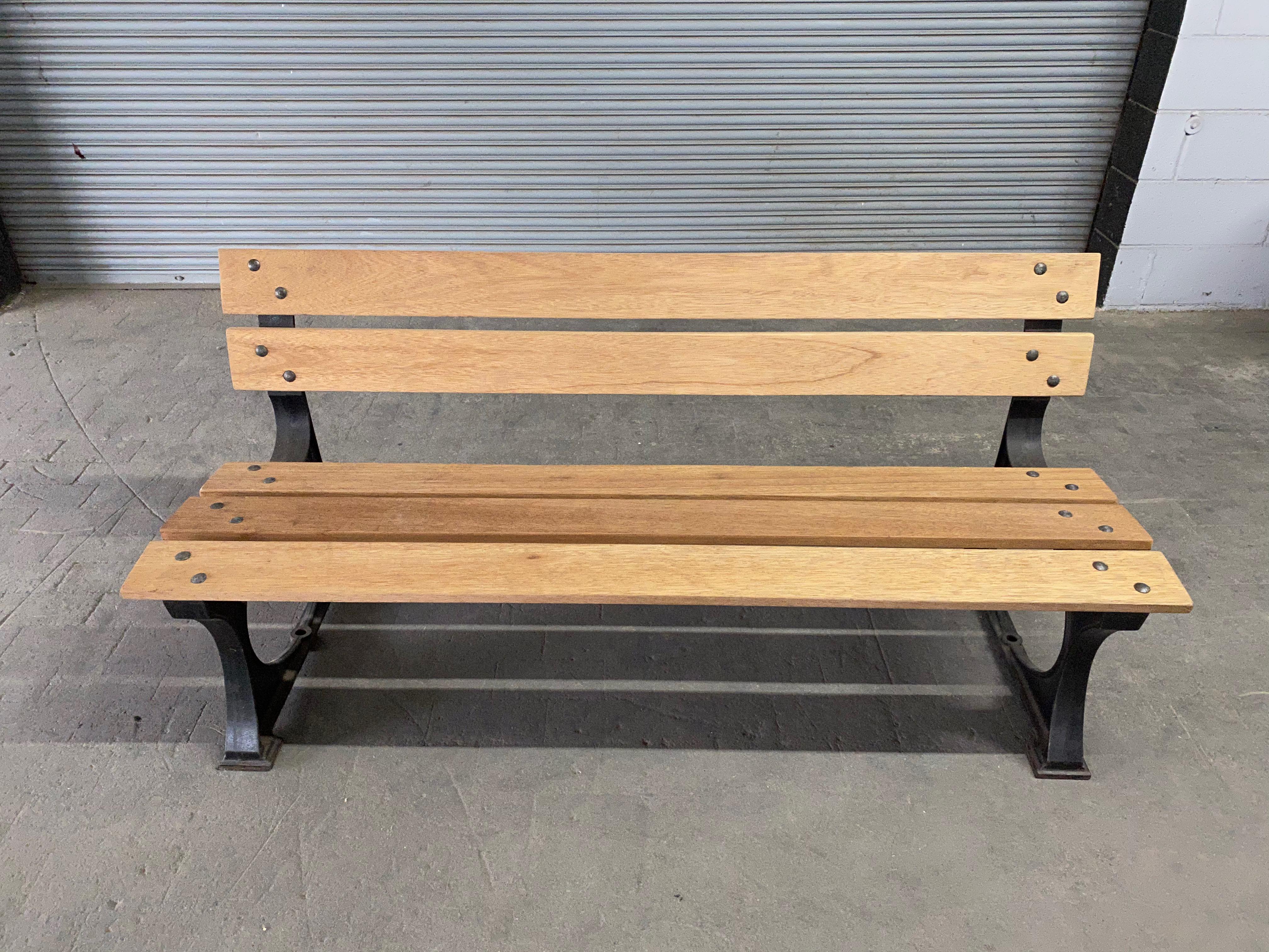 French Art Deco period garden bench with cast iron base. New mahogany wood slats have been added and finished with a light natural color stain. The seats and back will age very nicely with time and outdoor exposure.

 