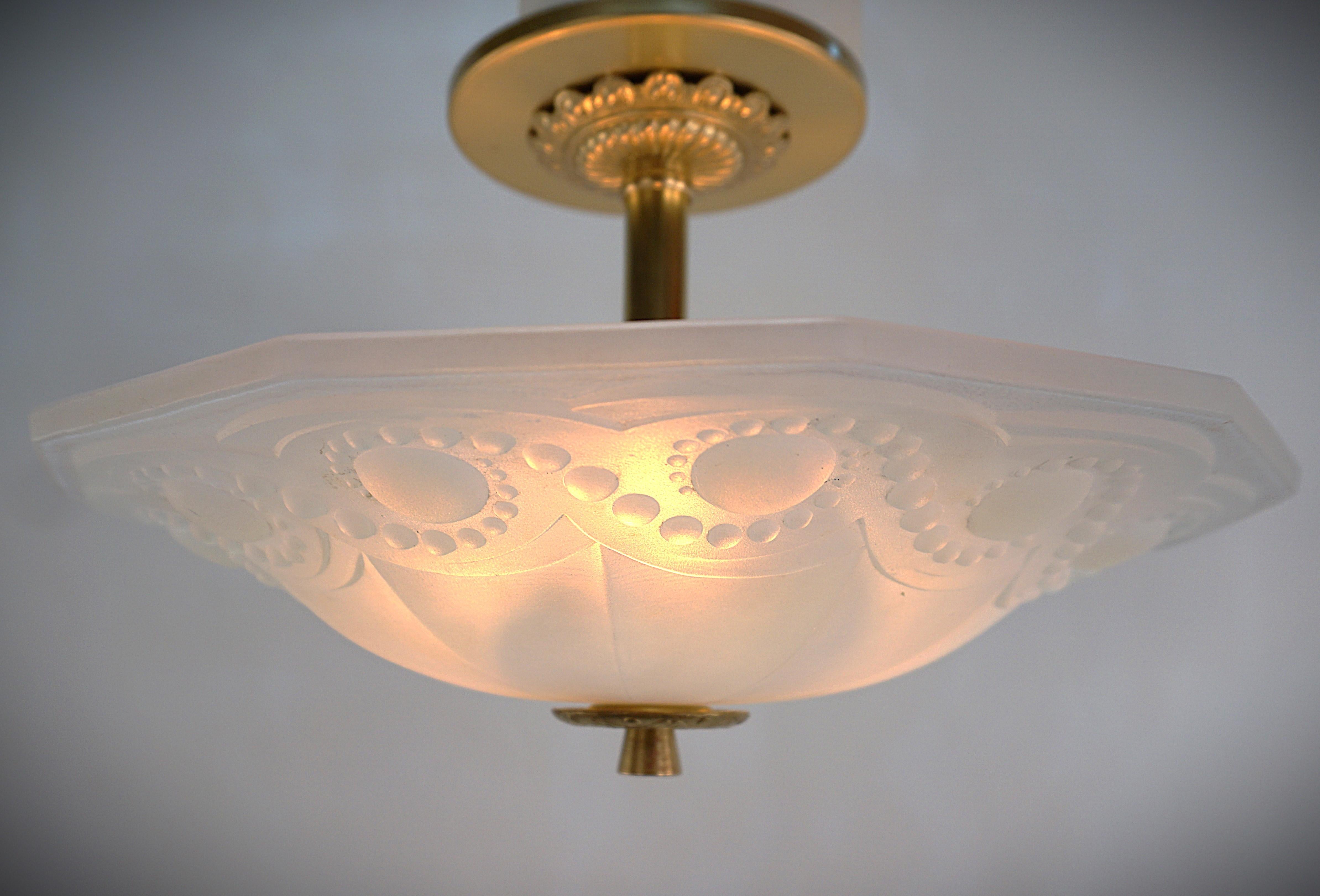 Beautiful octagon shape clear frost honey blue opalescent glass semi flush mount chandelier with bronze hardware.
Professionally rewired and ready for installation.
Three lights, 100 max each.