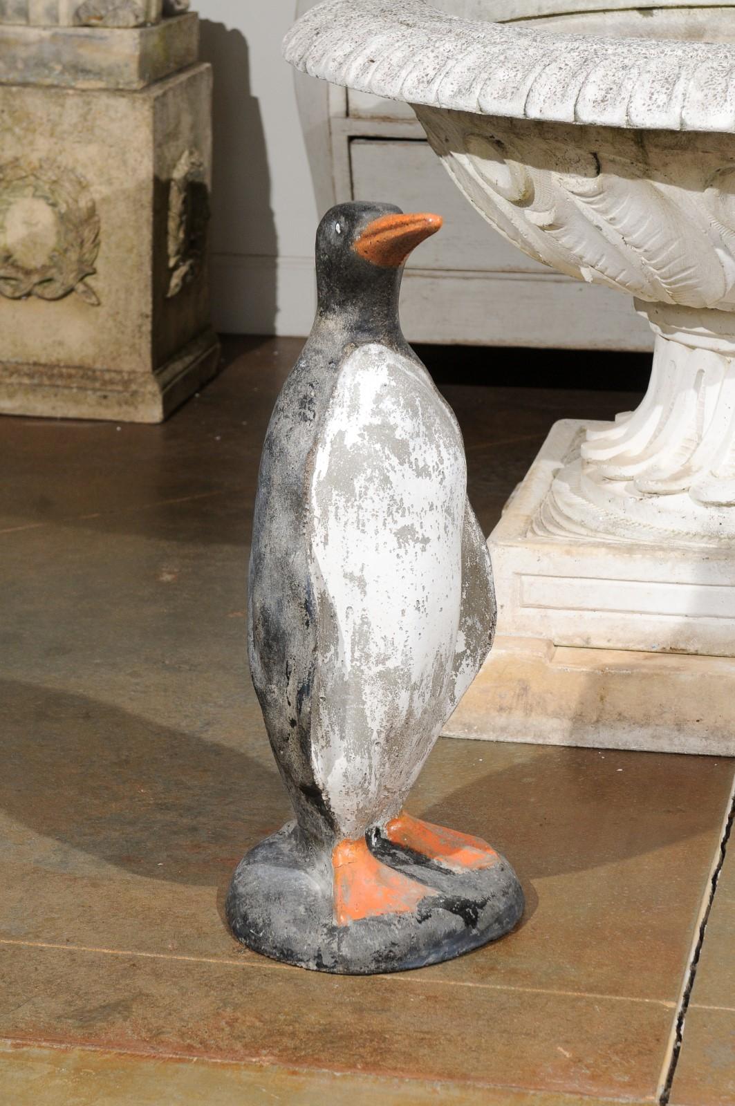 A French painted concrete garden sculpture from the early 20th century depicting a penguin. Created in France during the first quarter of the 20th century, this garden sculpture charms us with its lovely rendition of a life-size penguin. Boasting a