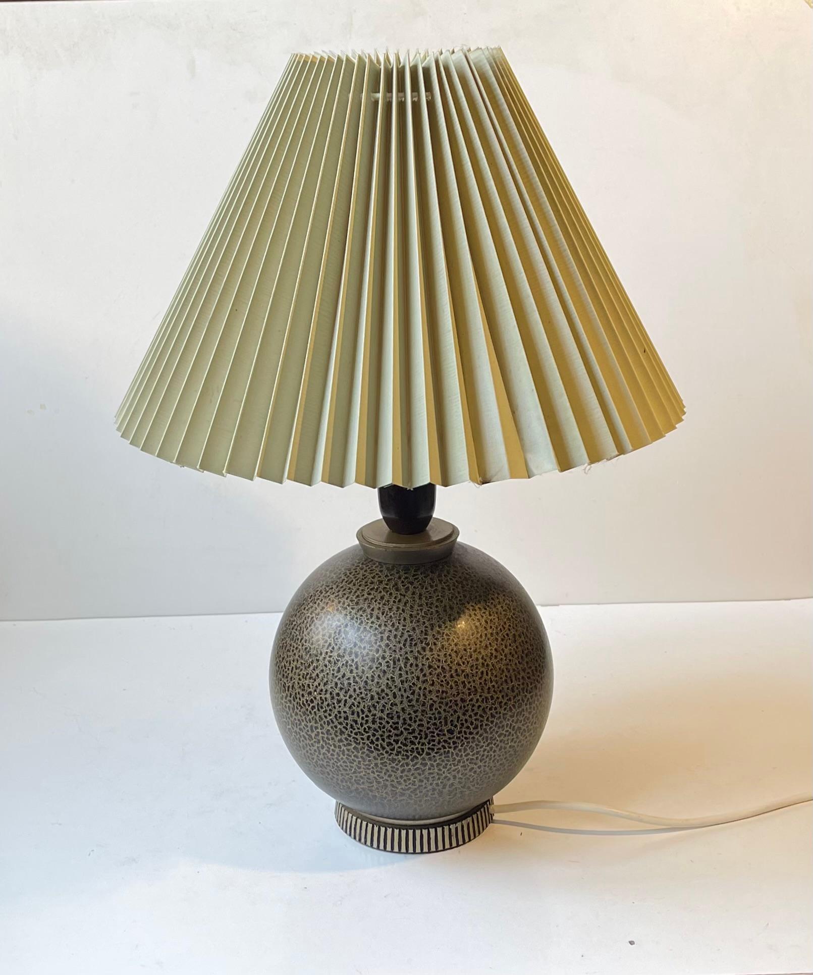 Playfully glazed spherical wooden table light in the style of Jean Besnard. Designed and created by anonymous designer/maker in France during the 1920s. No clear markings or signature to the base. This light is sold without a shade as they were