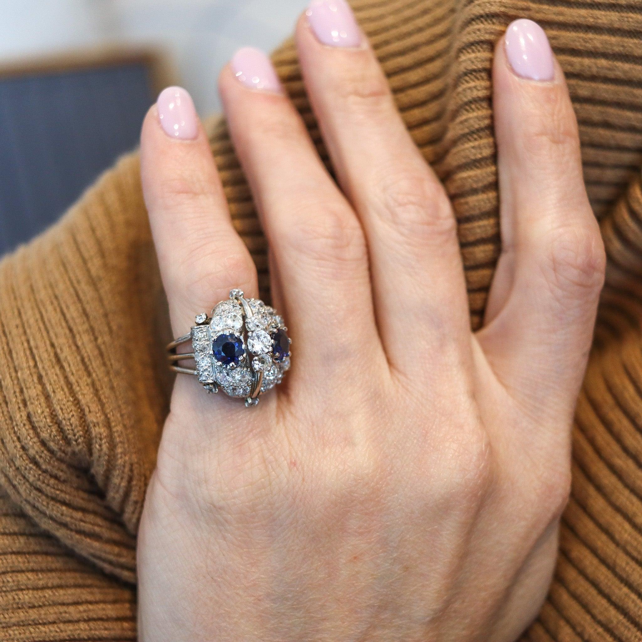 A French art-deco cocktail ring.

This is a beautiful cocktail ring created in Paris France during the art-deco period, back in the 1925. The gemset cluster ring has been masterfully crafted in solid .900/.999 platinum with polished finish and