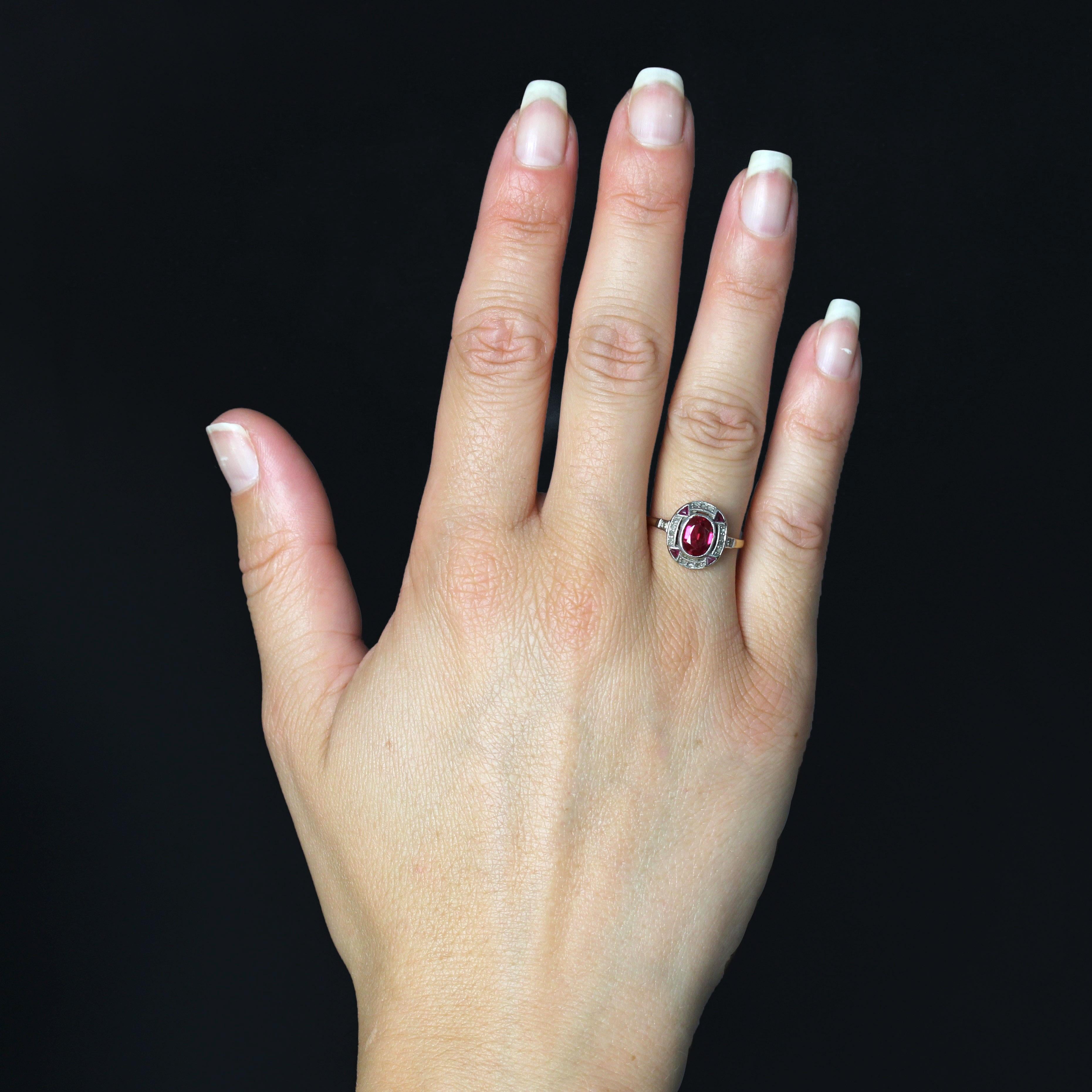 Ring in 18 karat yellow gold, eagle head hallmark.
A charming antique ring, it features a flat oval setting, with a synthetic verneuil ruby set in the center, surrounded by rose-cut diamonds and triangular synthetic verneuil rubies. A rose-cut