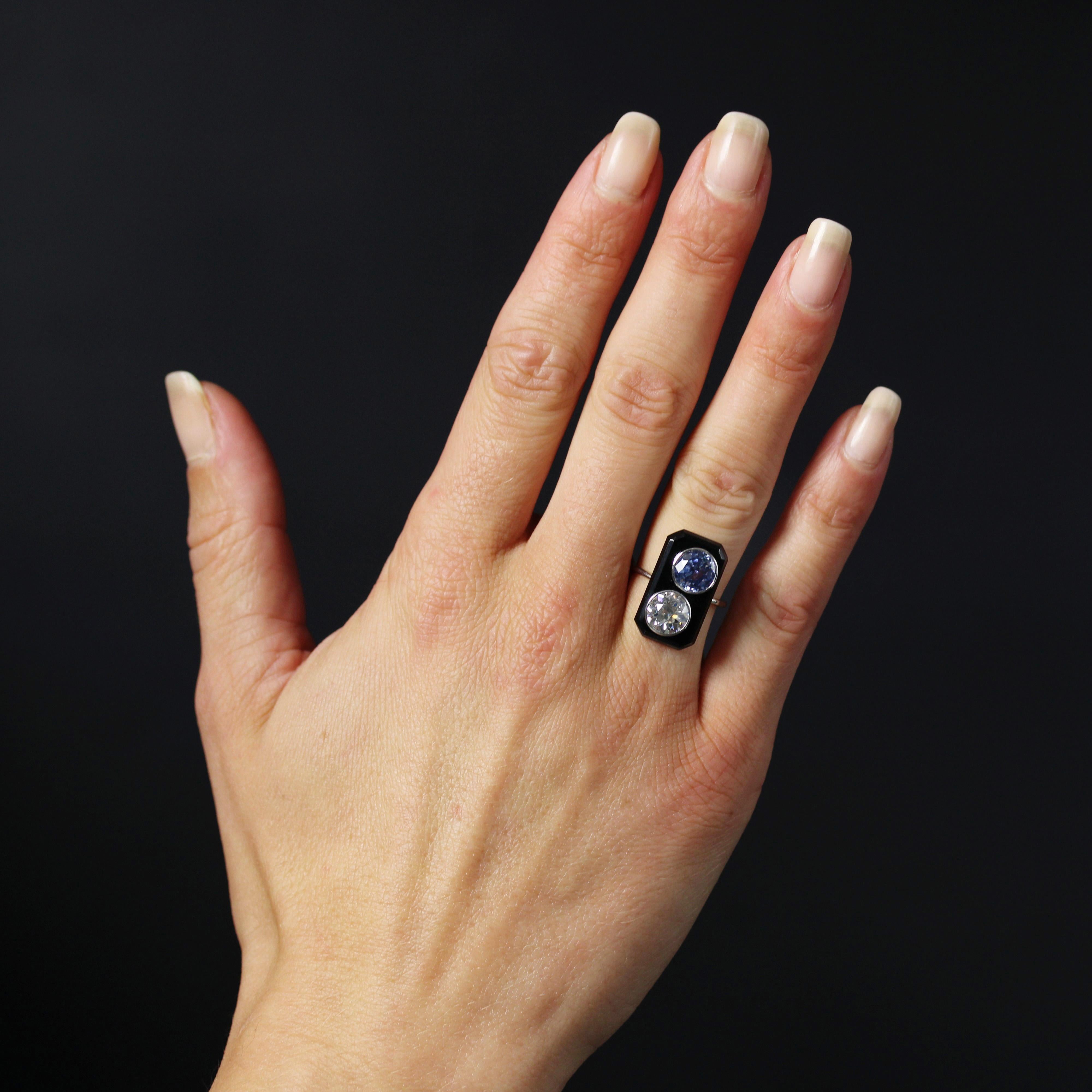 Ring in platinum.
A sublime Art Deco ring featuring a platinum mounting and band holding a rectangular cut onyx plaque. The onyx holds 2 asymmetrical settings : one a brilliant-cut antique diamond and the other a round faceted sapphire.
Total