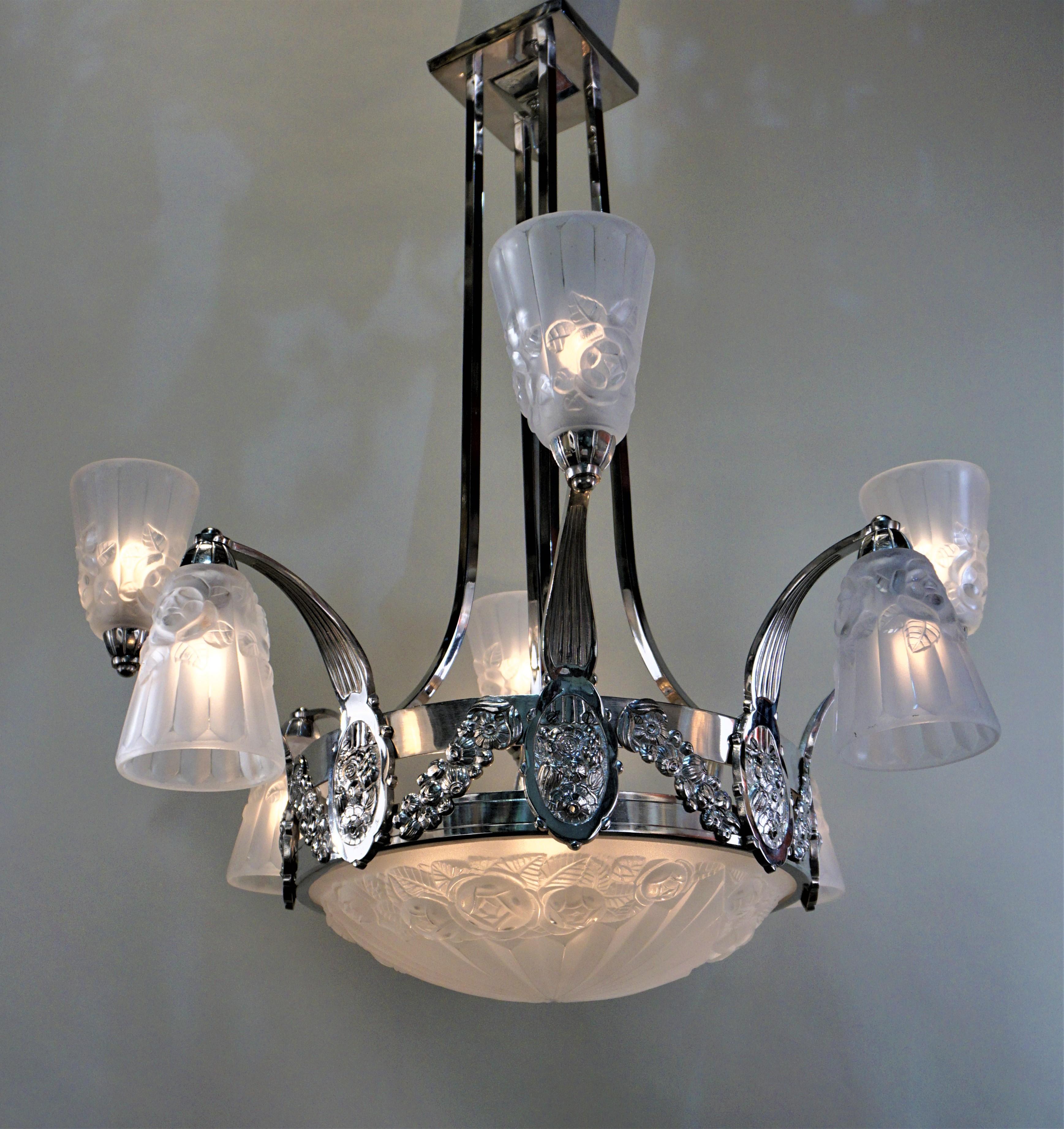 A rare Art Deco chandelier, frost clear glass polished nickel on bronze twelve lights by Degue.
