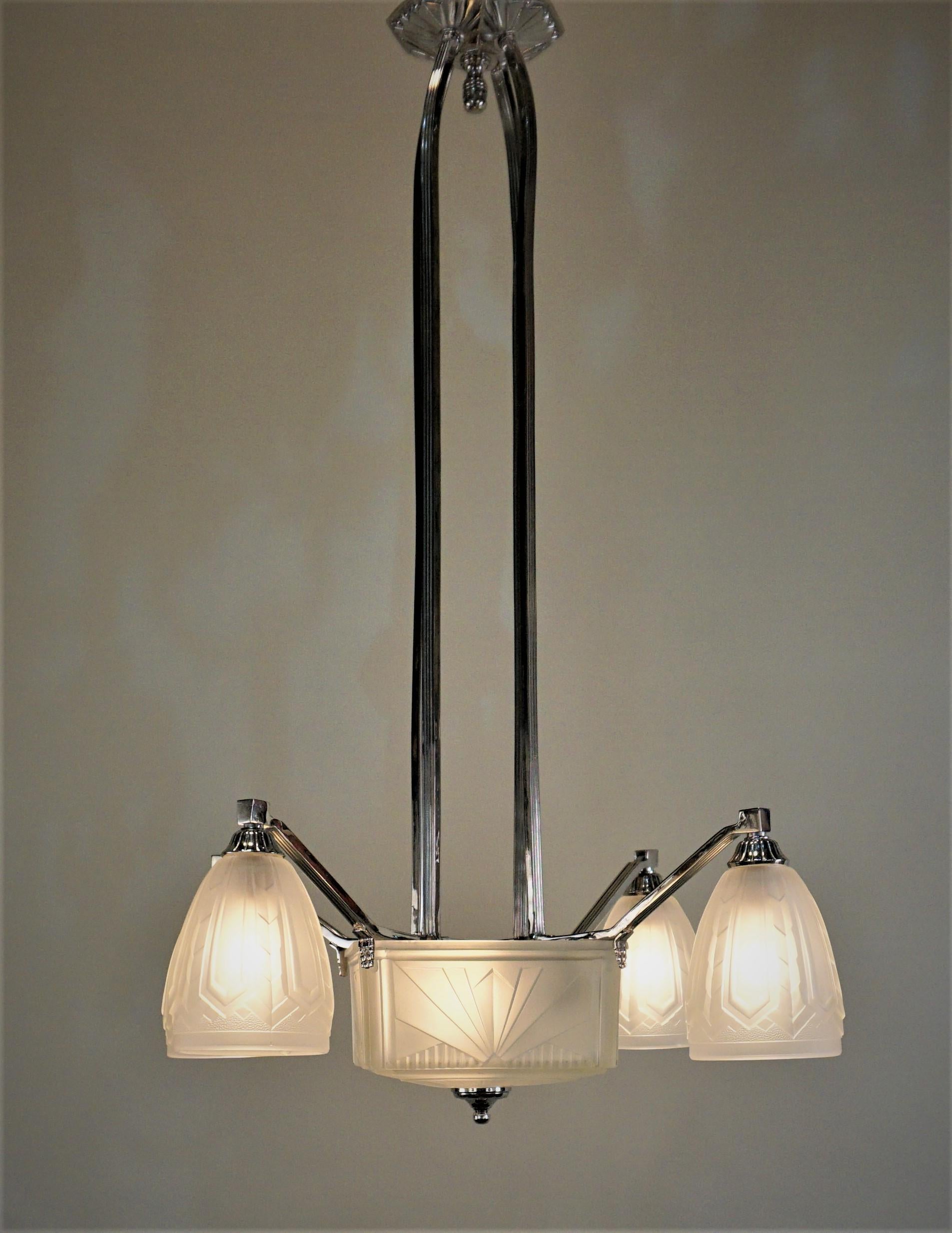 French 1930s geometric clear Frost glass with nickel on bronze chandelier.