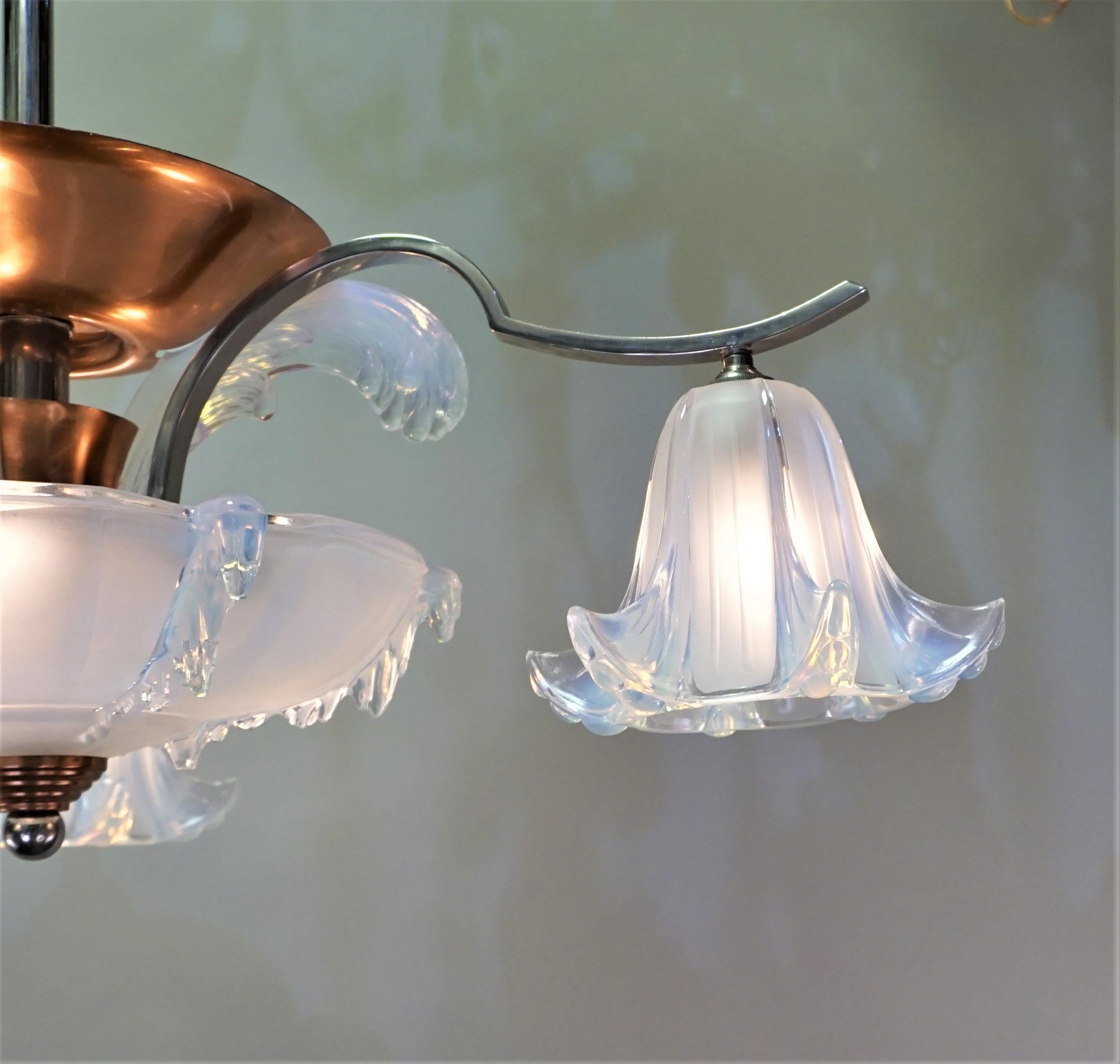 French two color, copper and nickel on bronze chandelier with light honey blue color opaline glass shades.