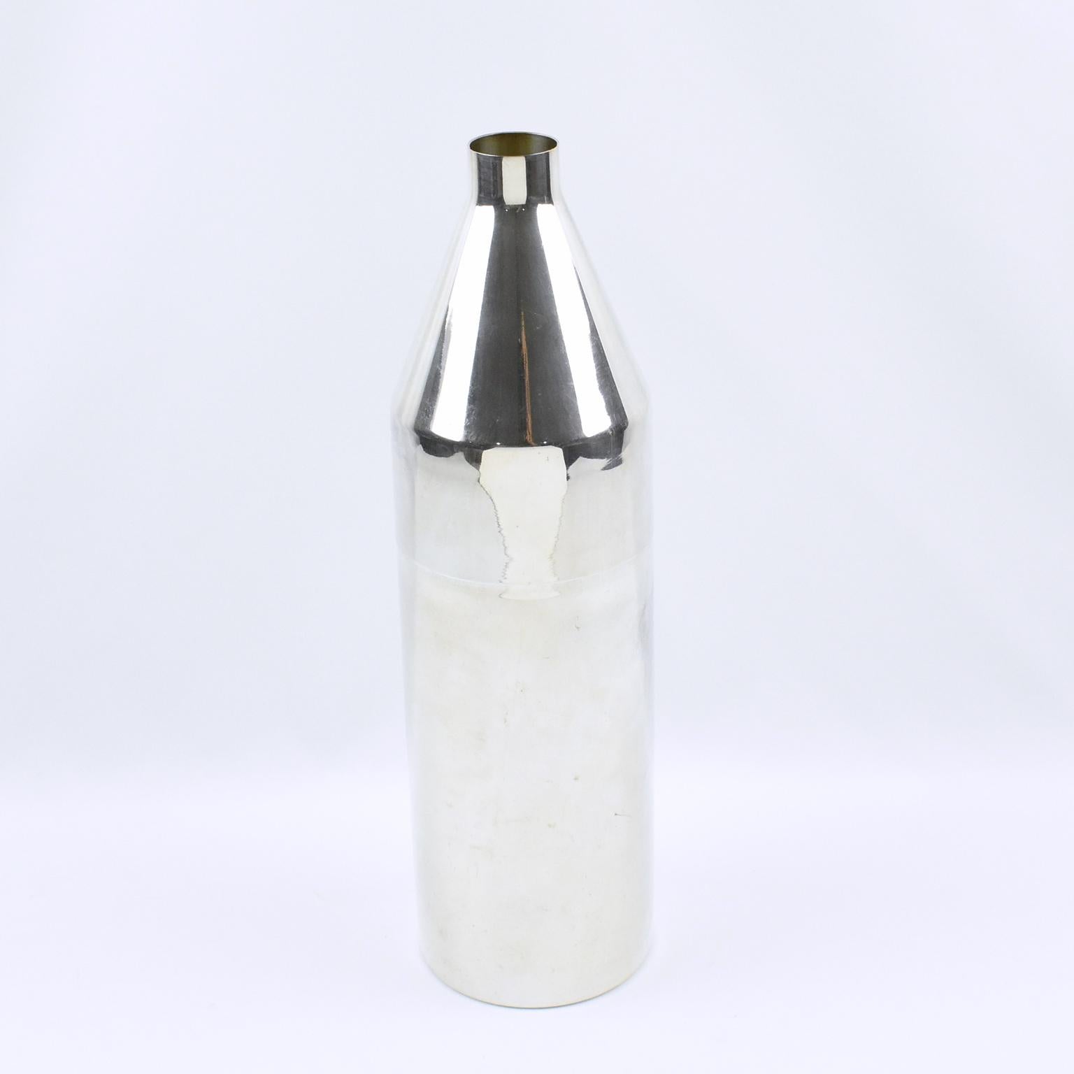 Lovely Art Deco barware accessory, silver plate wine bottle cooler by SFAM, Paris. Streamline design with sleek lines. The cooler splits in two sections to receive the wine bottle as shown on pictures. Marked underside with silversmith legal