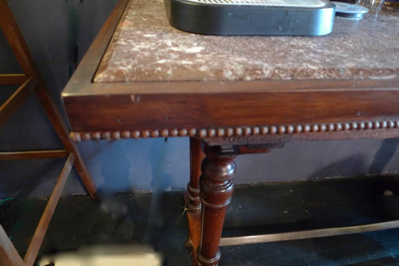 French 1930s bistro table on walnut and iron frame with red marble top.