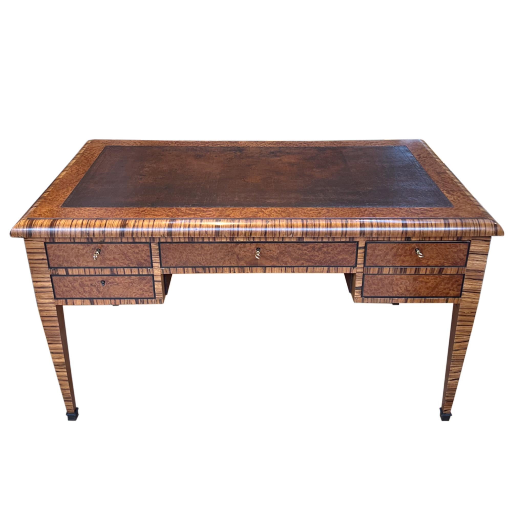 An exceptional desk. This lovely piece of furniture is made from burr walnut and zebrano wood, giving it an amazing finish and appearance. 

Decorative and practical - please take a look at all our pictures to see the well constructed drawers, with