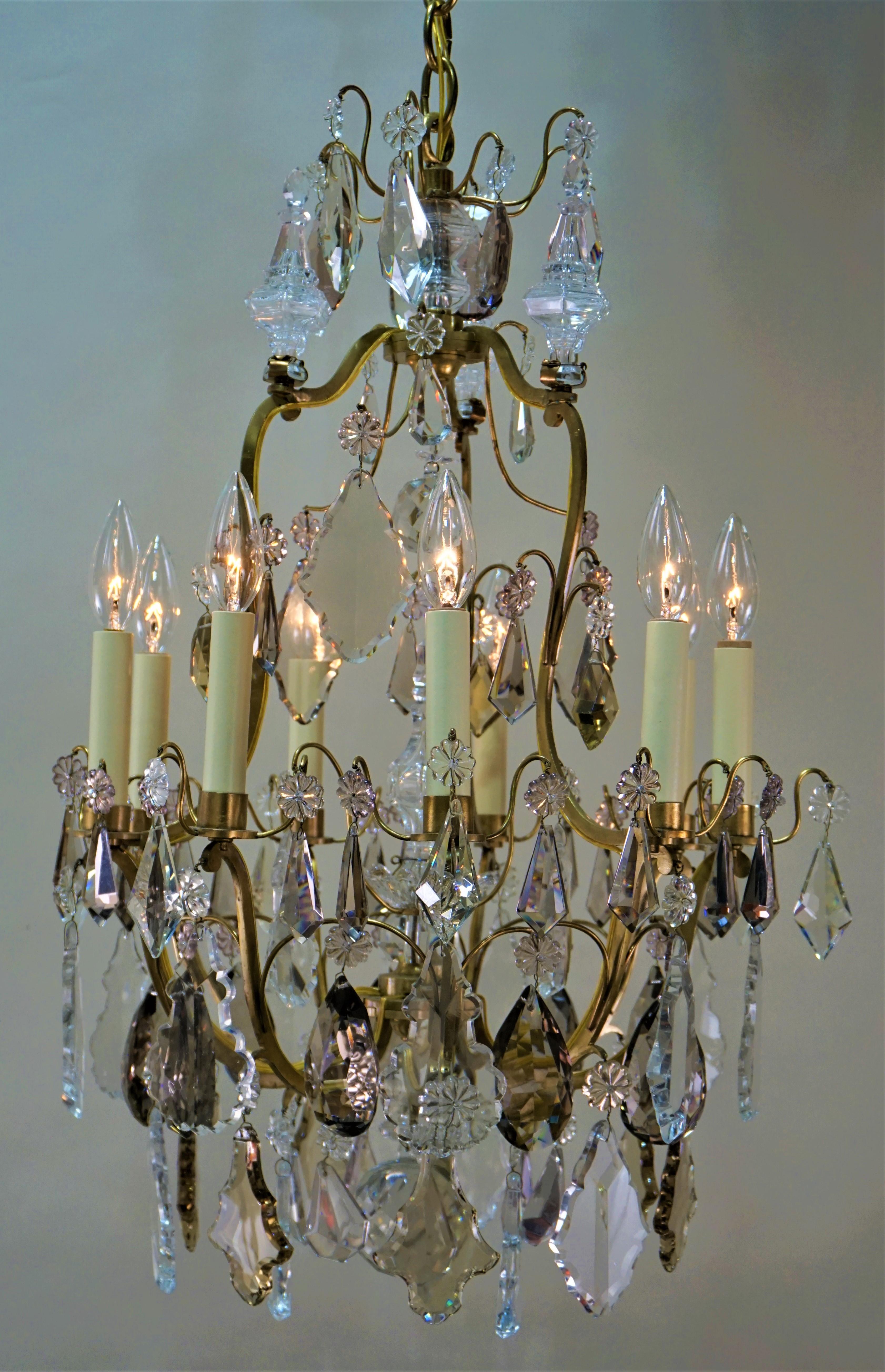 Clear and colorful crystal chandelier with elegant bronze frame.
Minimum height full installed 32
