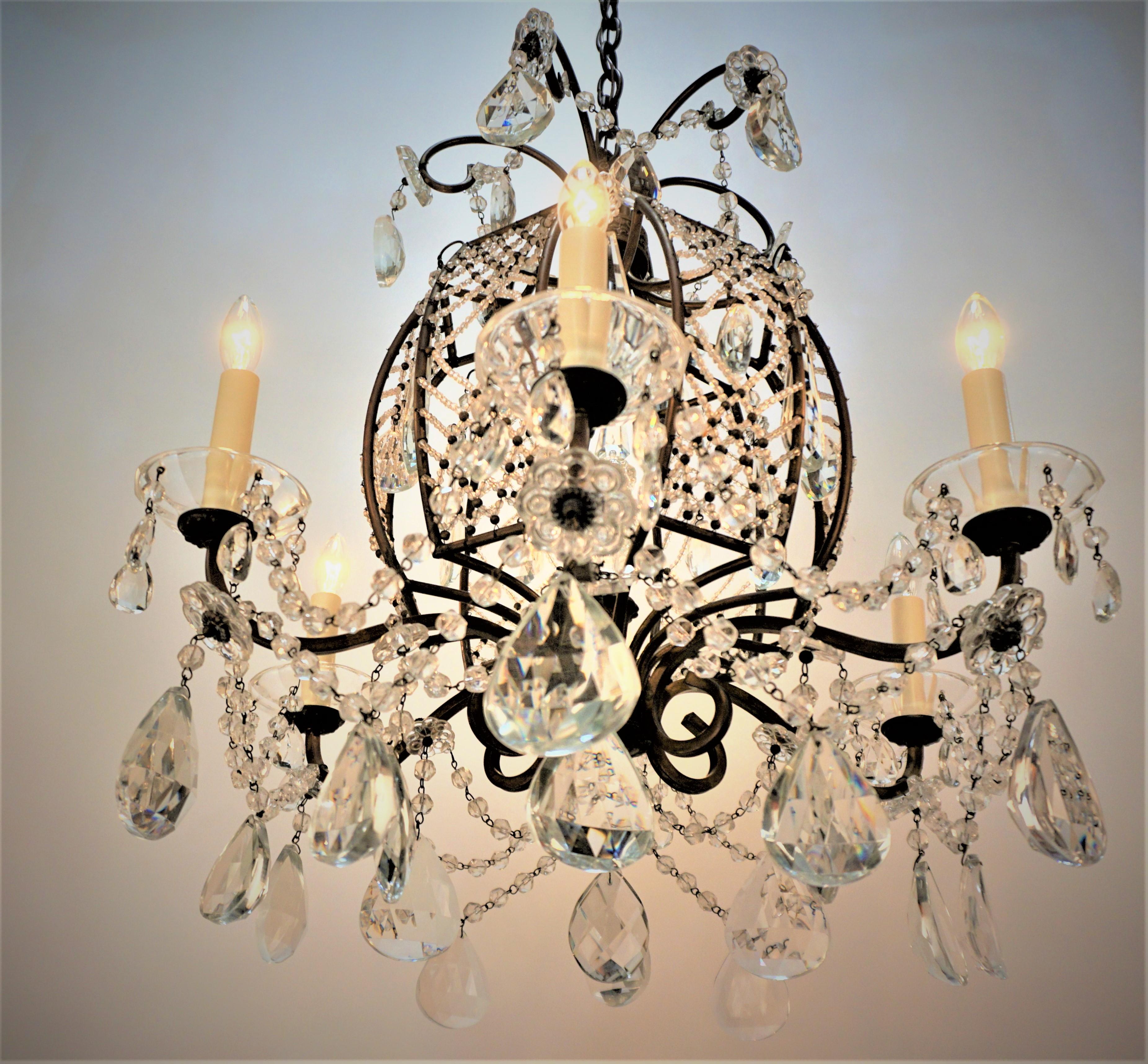 Beautiful 1930's crystal lace work, cut crystal with bronze frame 1930's chandelier.
Measurement: 22