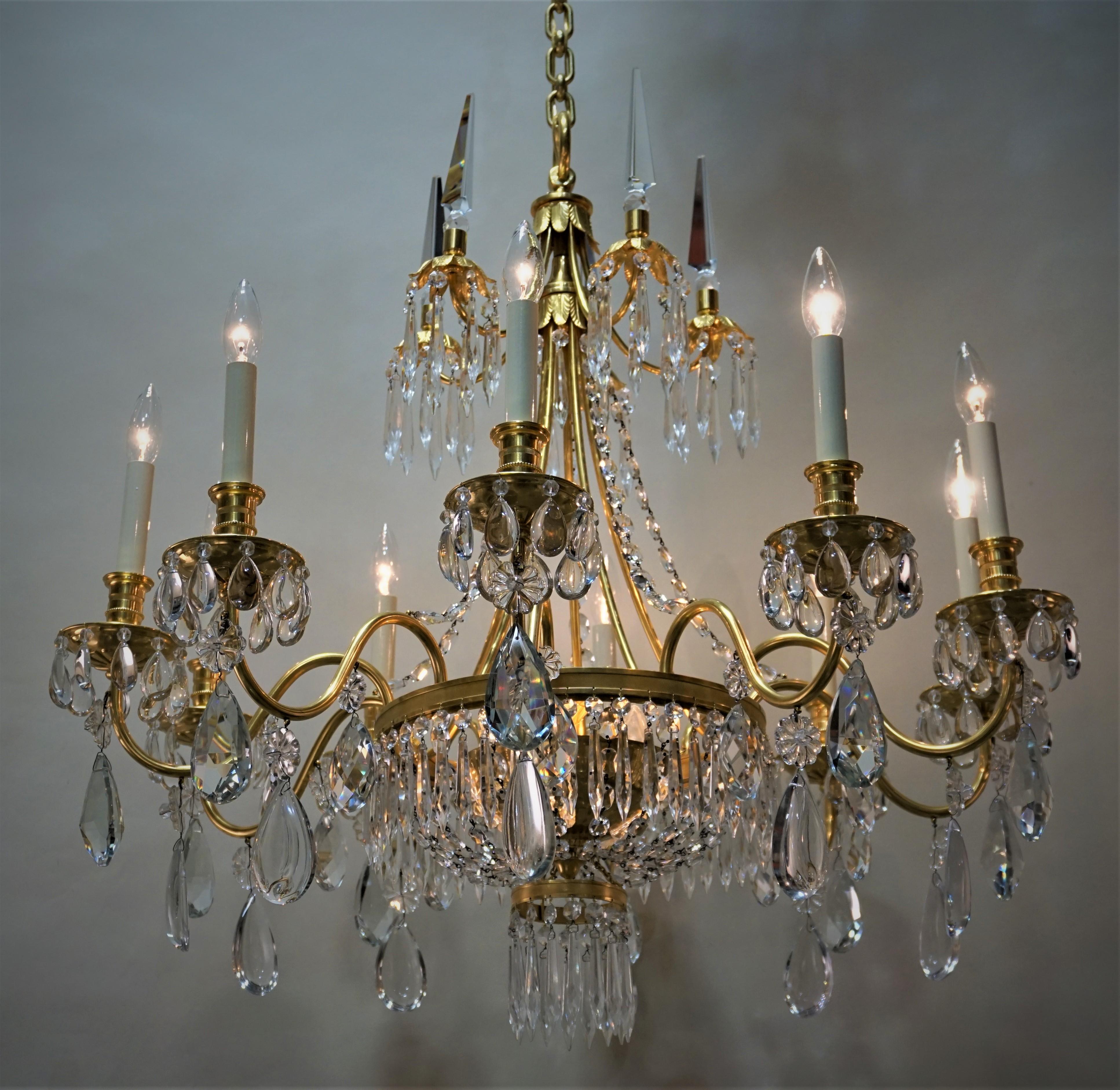 Elegant 1930s crystal and gilt bronze ten-arm with thirteen-light chandelier.
Total height 60