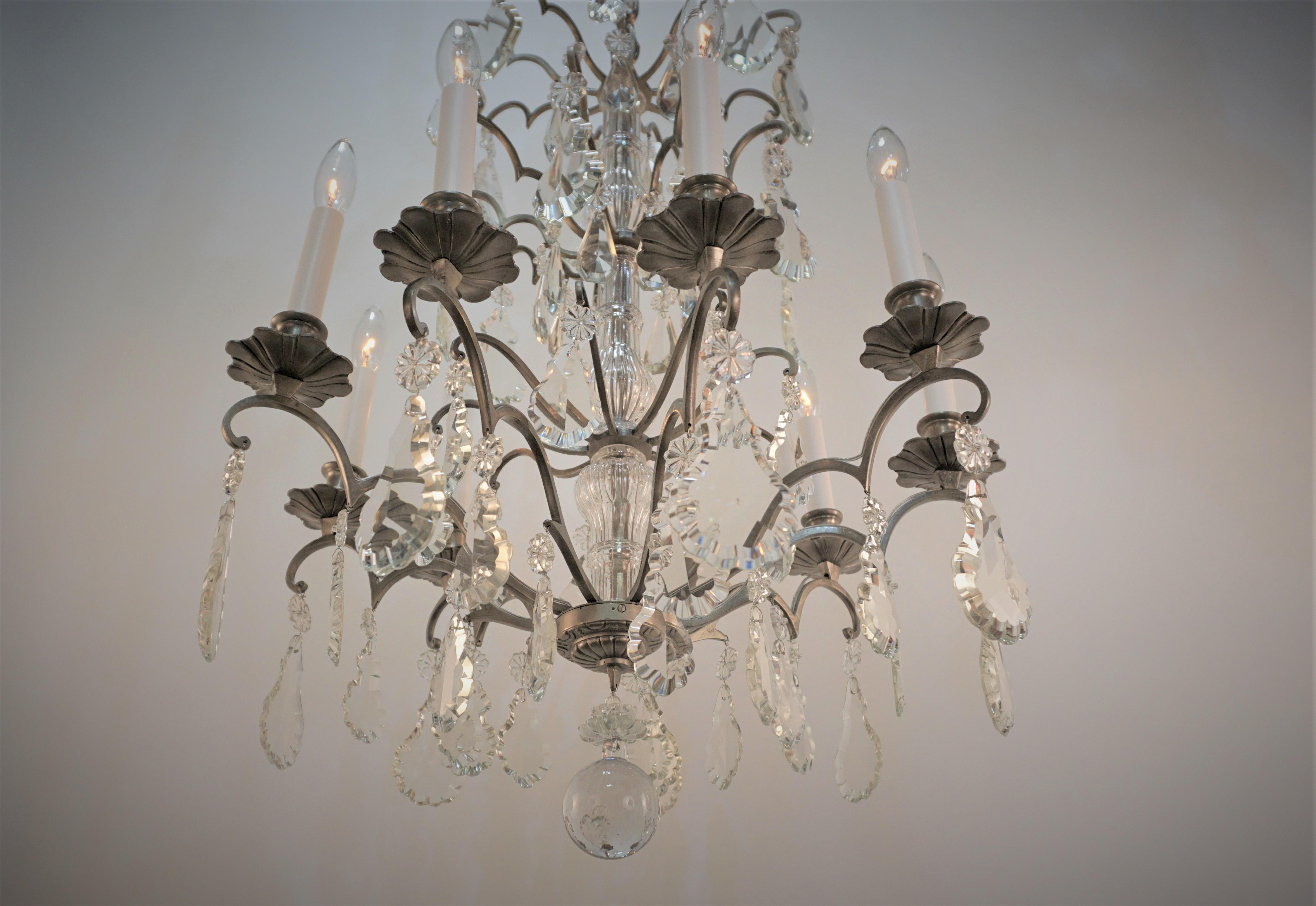 Elegant eight arm crystal chandelier with semi oxidized (pewter color) silver on bronze frame 1930's chandelier.
Minimum height fully installed 32