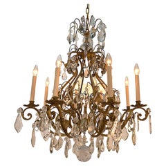 Lampadario francese in cristallo e ferro dorato degli anni '30
