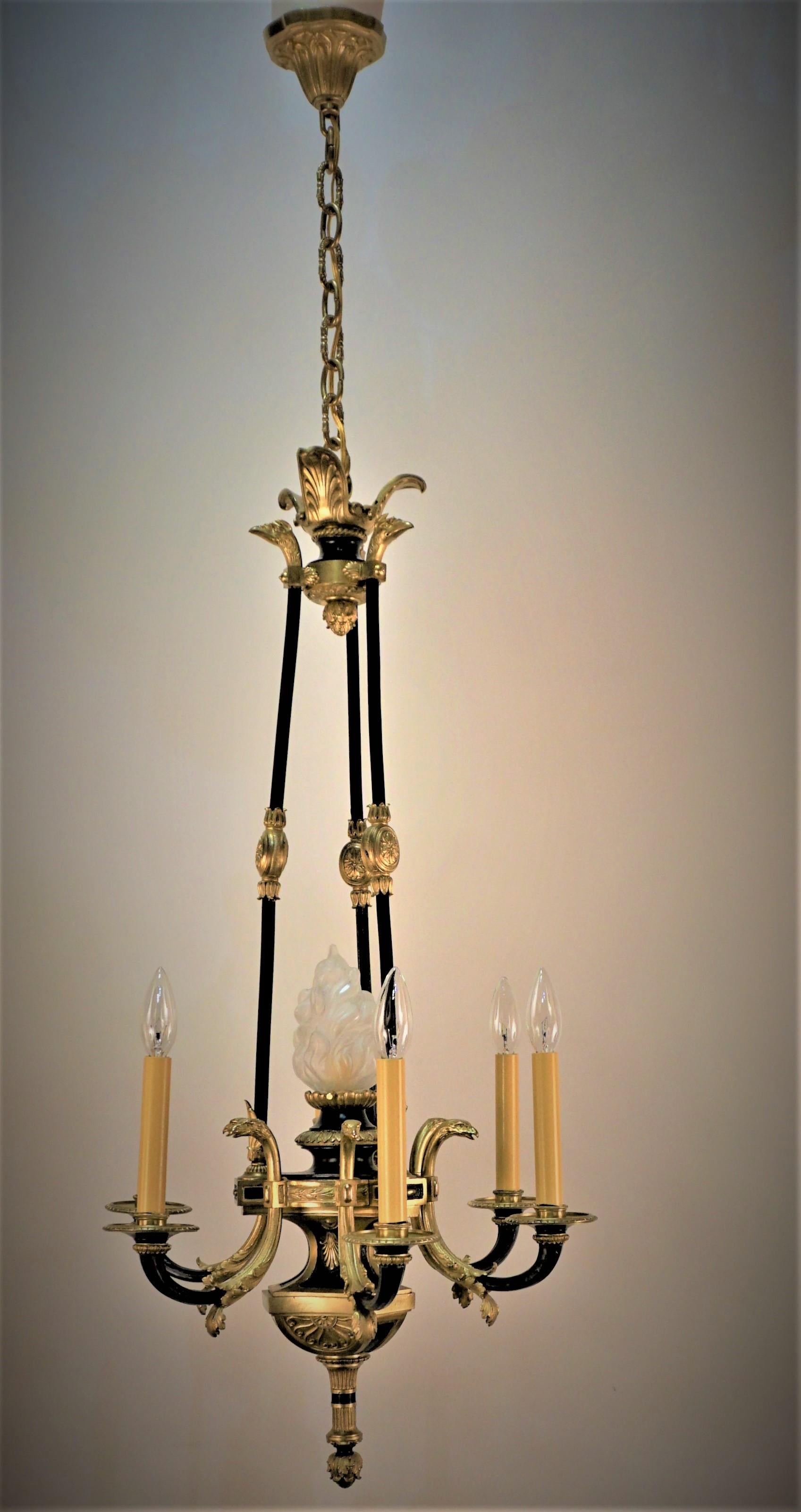 This fabulous empire chandelier. This stunning fixture is made of beautiful black lacquer and ornate bronze.
Professionally rewired and ready for installation.
Seven lights, 60 watts max each.