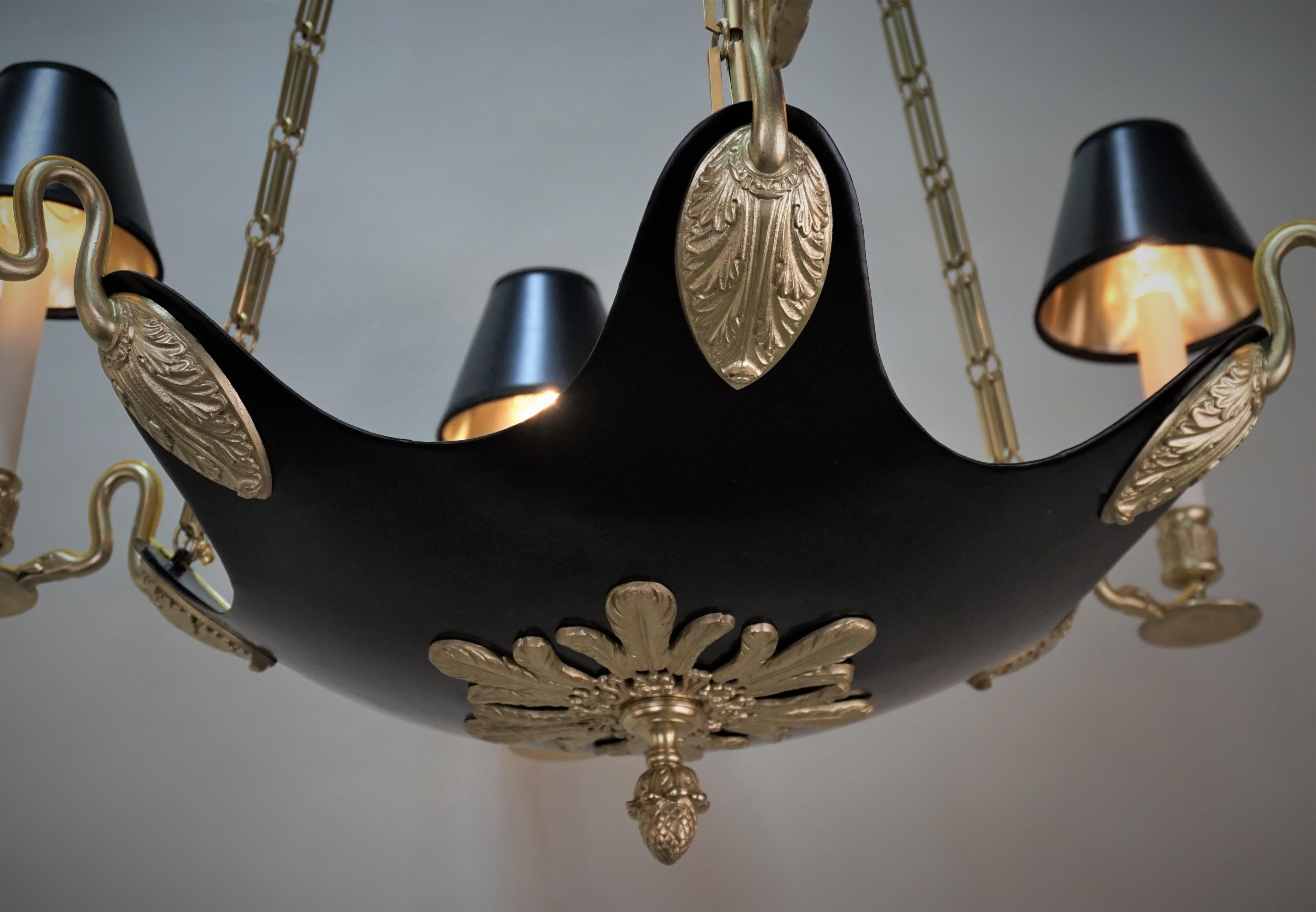 Six light swan arm, bronze and black lacquer on bronze empire style chandelier.