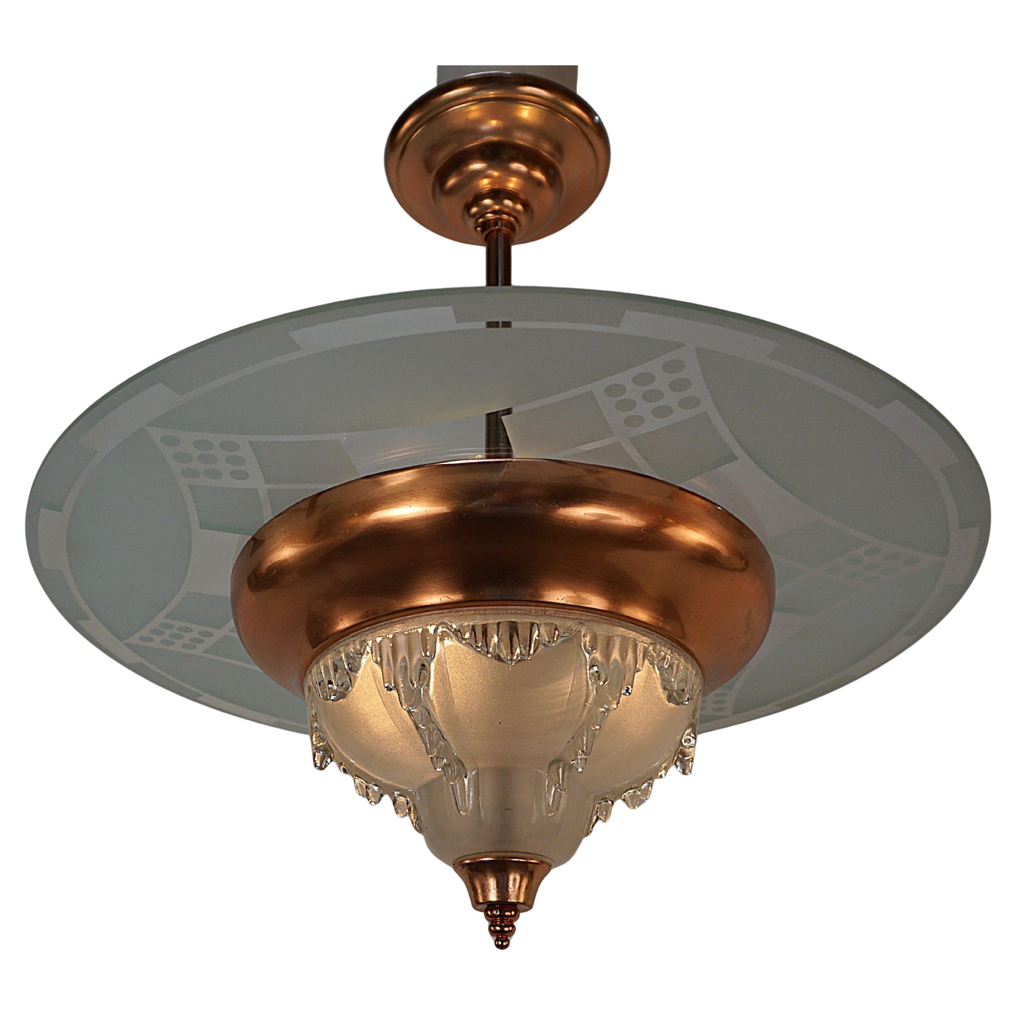 French 1930's- etched glass disc and copper on bronze art deco chandelier.
Professionally rewired and ready for installation.