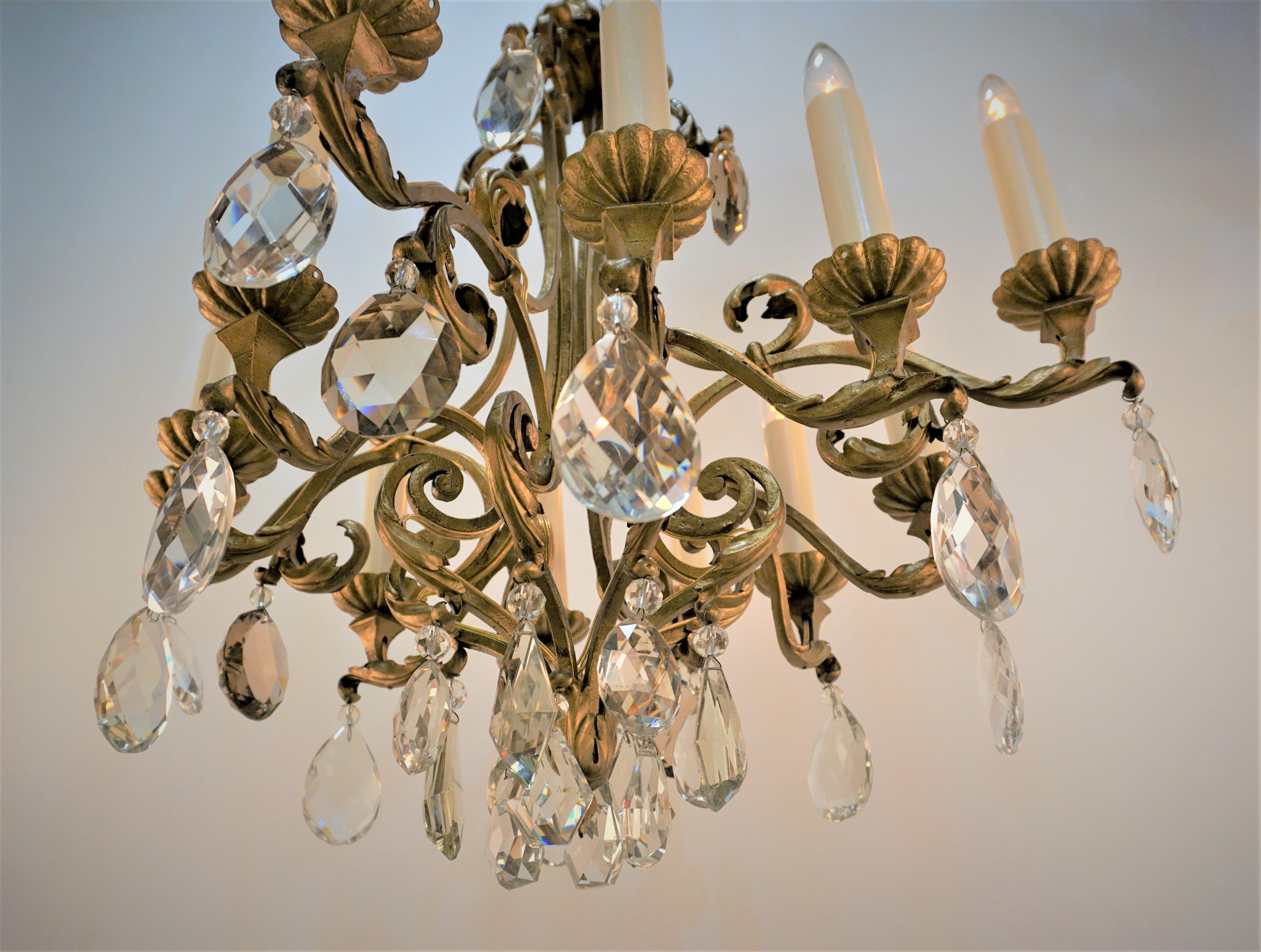 Gilt French 1930's gilt Iron and Crystal chandelier For Sale