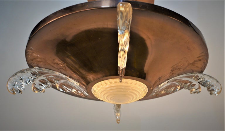 Beautiful copper over bronze with glass semi flush mount chandelier.
Total of eight lights 60 watts max each.
