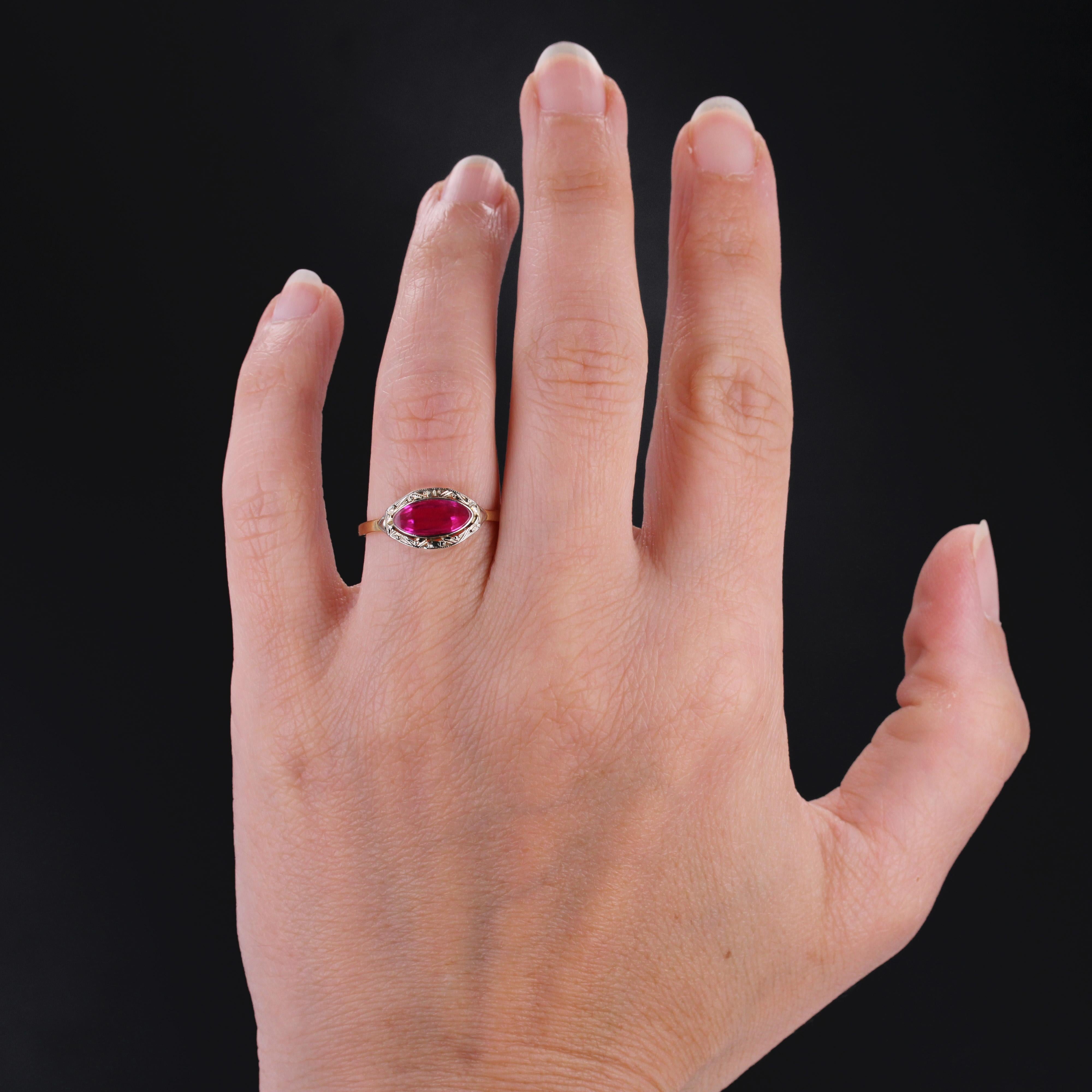Ring in 18 karat yellow gold, eagle head hallmark.
Antique ring featuring a flat, navette-shaped synthetic ruby set in a chased setting.
Height : 7,5 mm approximately, width : 13,5 mm approximately, thickness : 2,6 mm, width of the ring at the base