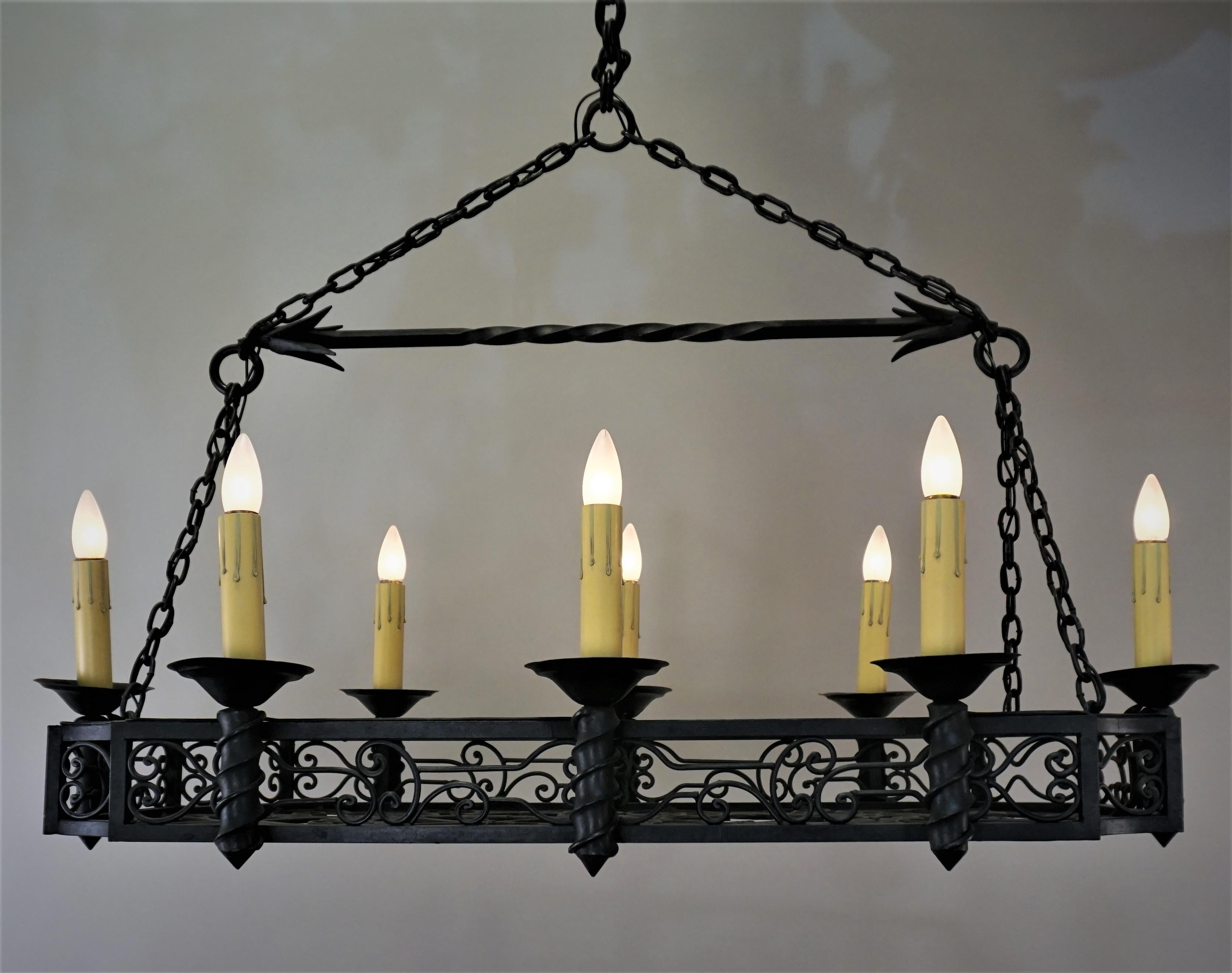 Elegant large oblong wrought iron chandelier. This beautiful chandelier was handcrafted in France, 1930s.
Measurement: 26