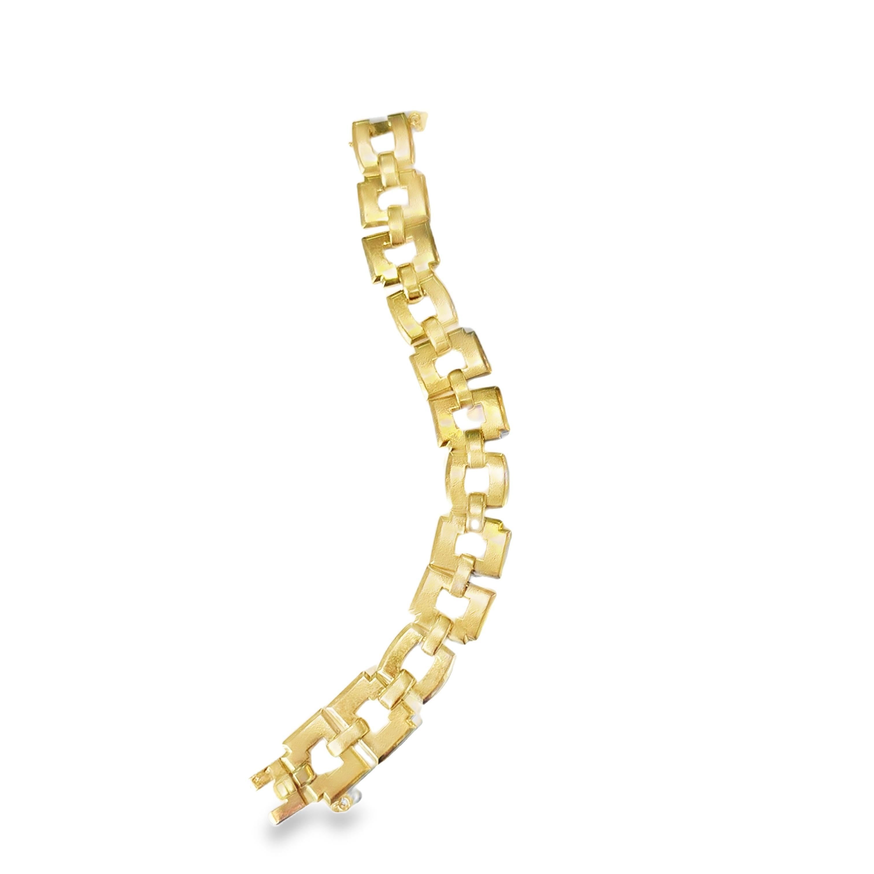 This exceptional 1940s French bracelet showcases a bold and sophisticated geometric design, meticulously crafted in 18k yellow gold. The interlocking rectangular links create a dynamic and harmonious rhythm, reflecting the timeless elegance and