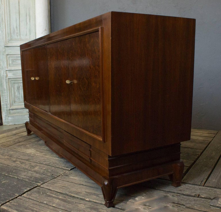 Stunning French 1940's elm burl sideboard. Doors open to interior shelving, there are 3 lower 