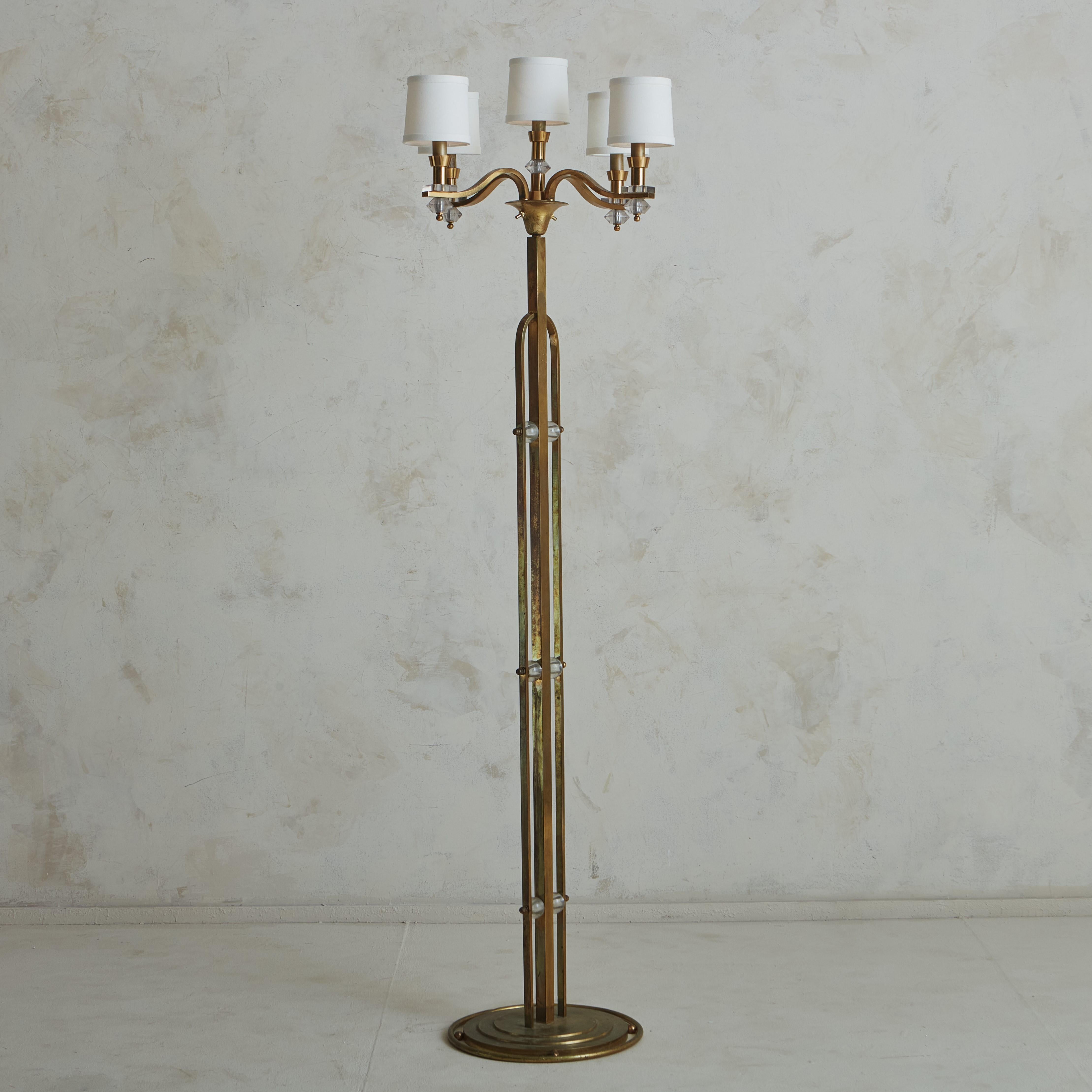 A French 1940’s floor lamp. Made by the combination of 3 materials: polished copper for the base and arms, glass for the connections and details, and textile for the 5 shades. This item, with its sturdy structure and a reinterpretation of the