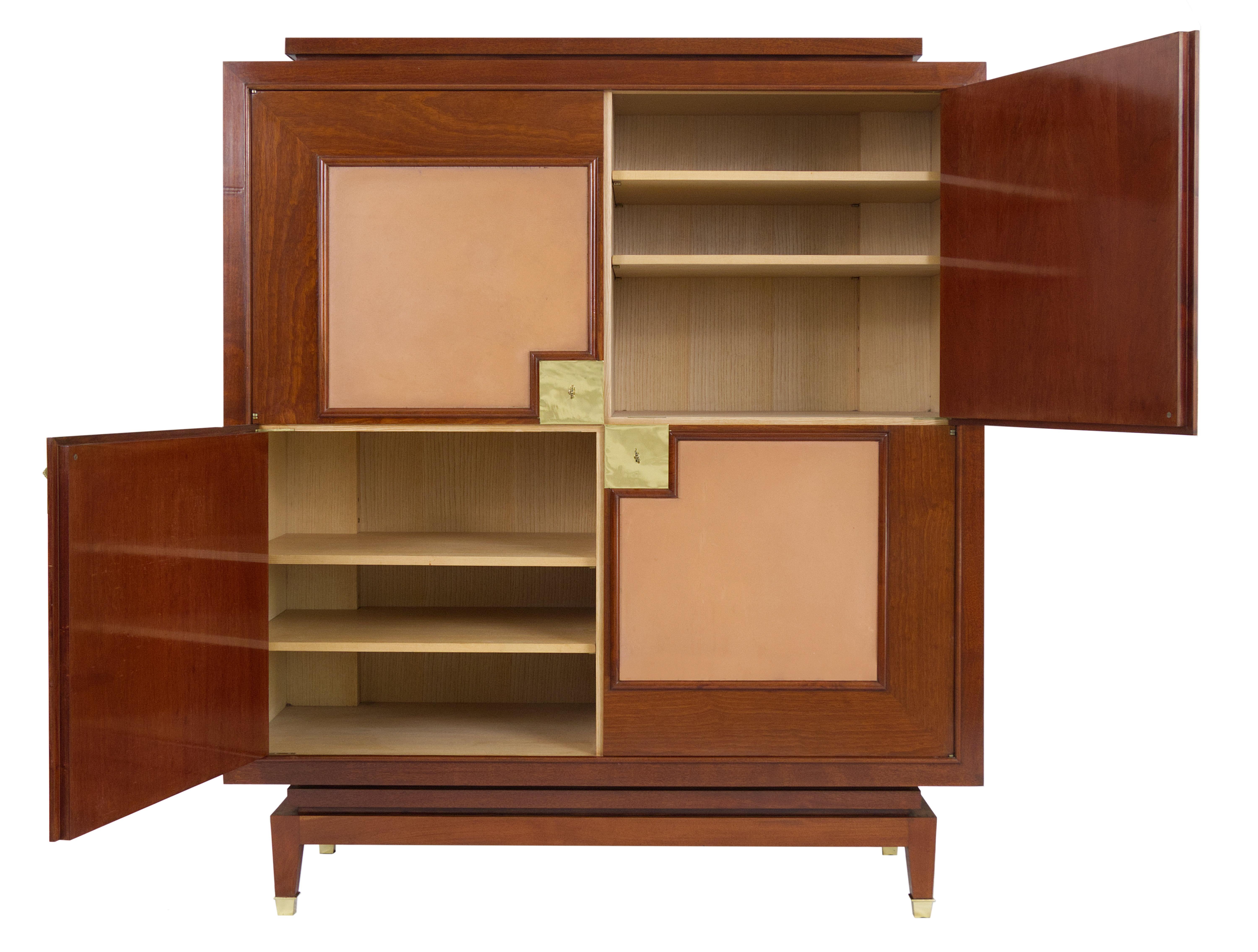 Perfectly proportioned small French Art Deco living room cabinet/ bar cabinet made of mahogany and leather veneer with the best craftsmanship and probably designed by Rousseau et Lardin around 1940. The strictly geometrically designed cabinet has a