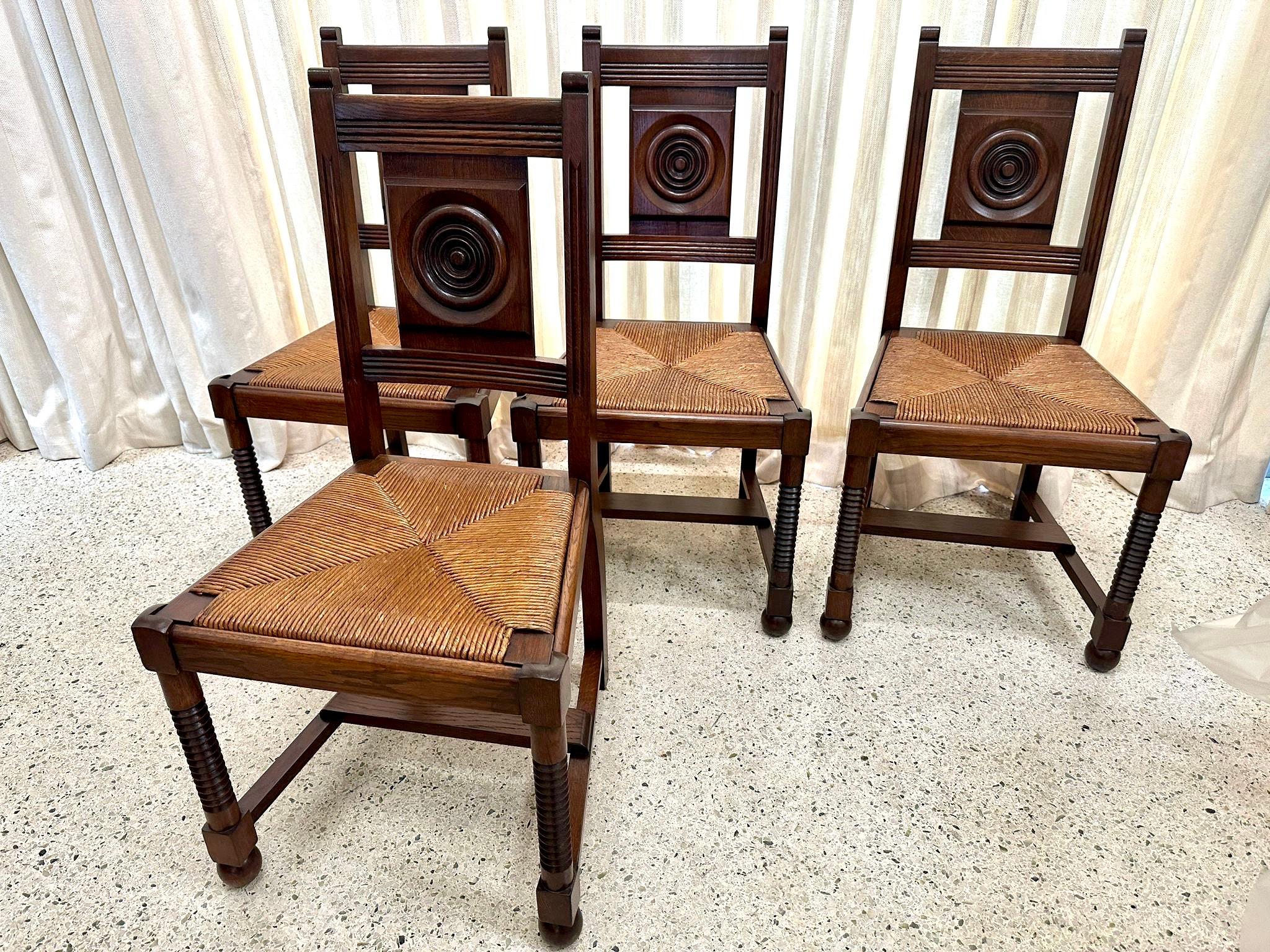 French 1940's Charles Dudouyt Oak & Rush Dining Chairs - Set of 4 In Good Condition For Sale In East Hampton, NY