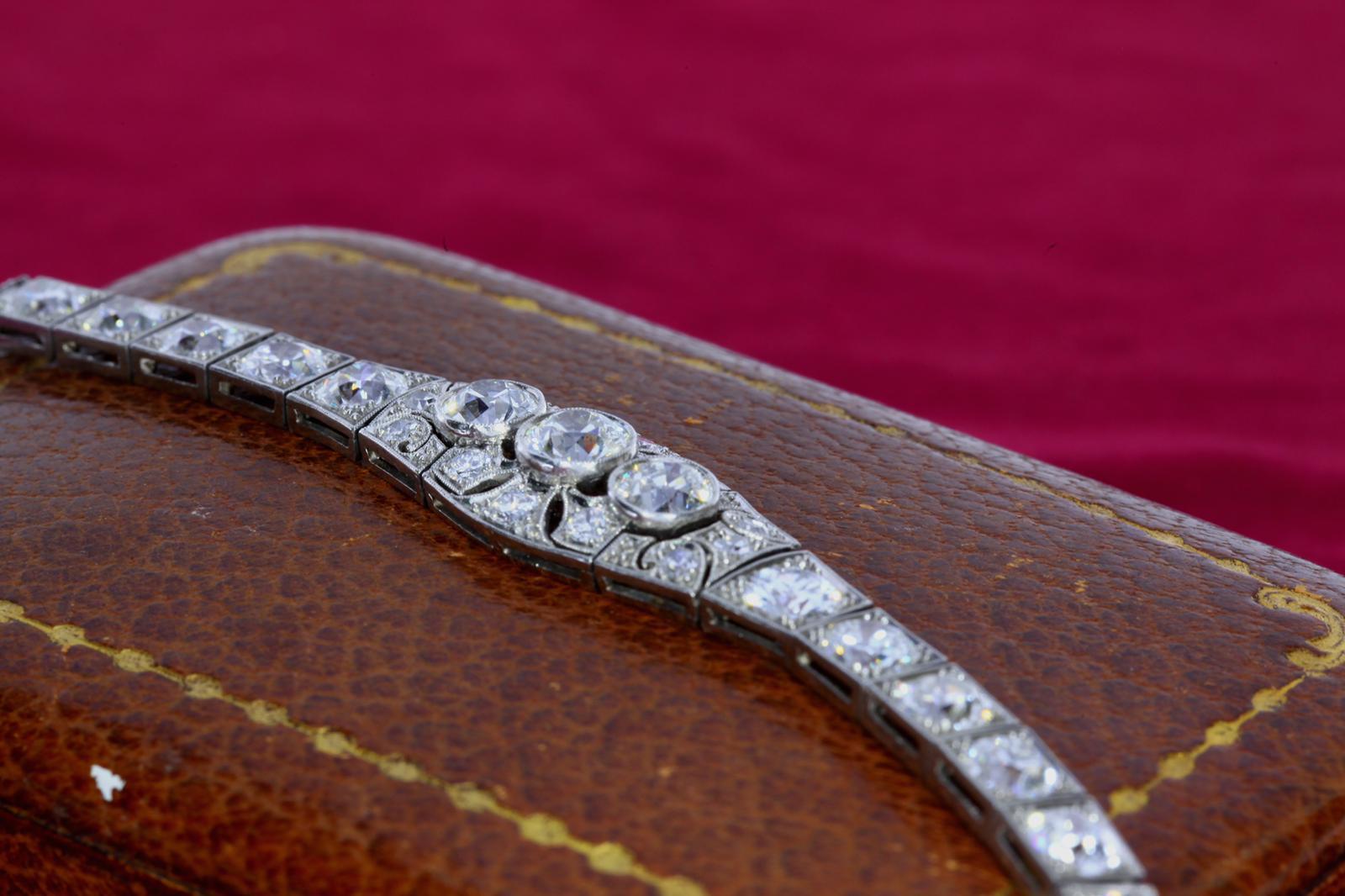 Approximately 9 carats of diamonds set in an art nouveau french made platinum bracelet from the 1940s. The diamonds display the typical cutting style from the era with high crowns and nice luster. 