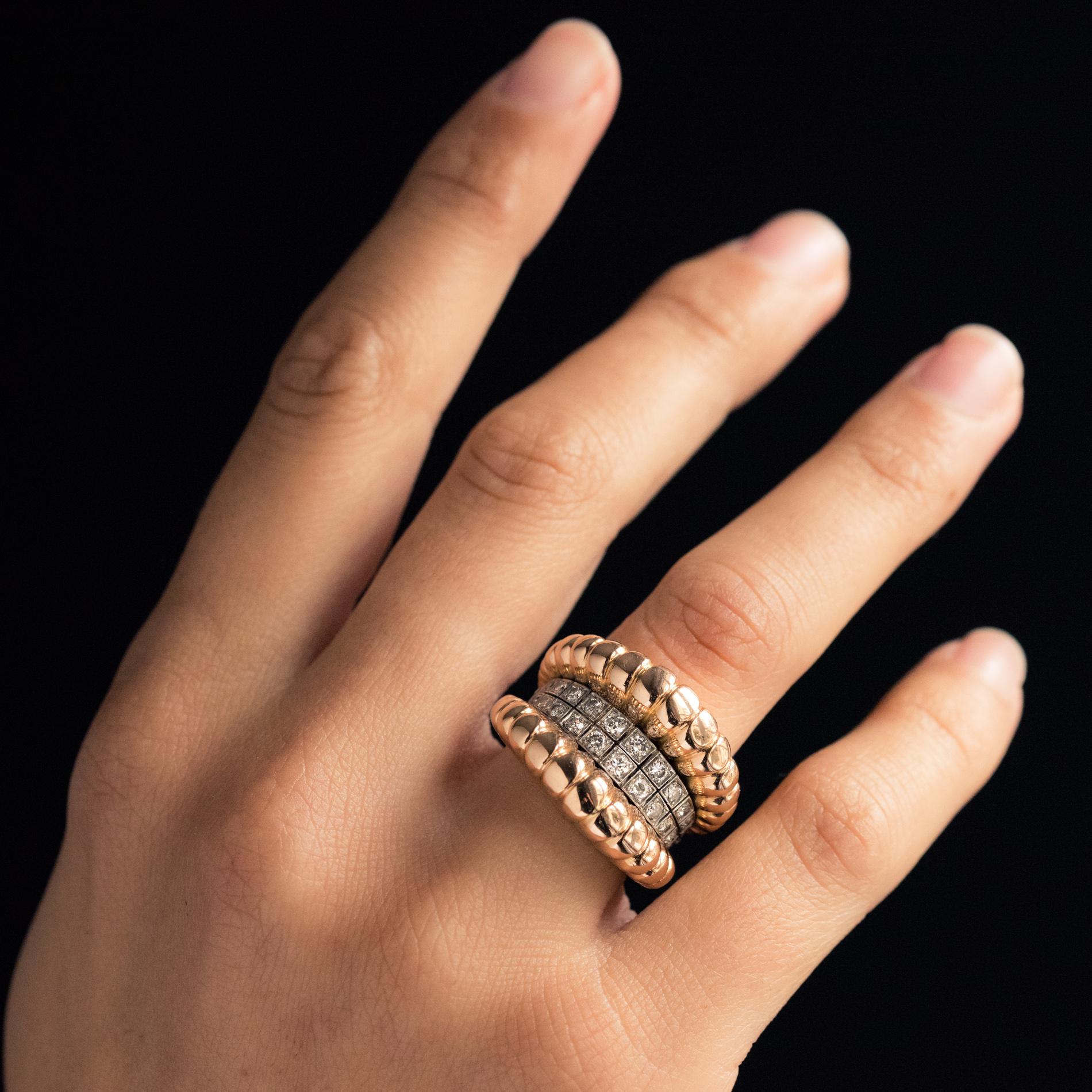 Ring in 18 karat yellow gold, eagle's head hallmark, and platinum, dog's head hallmark.
This sublime retro ring is formed by a double motif of falling gold gadroons, interspersed with a double row of diamonds set in platinum.
Total diamond weight :