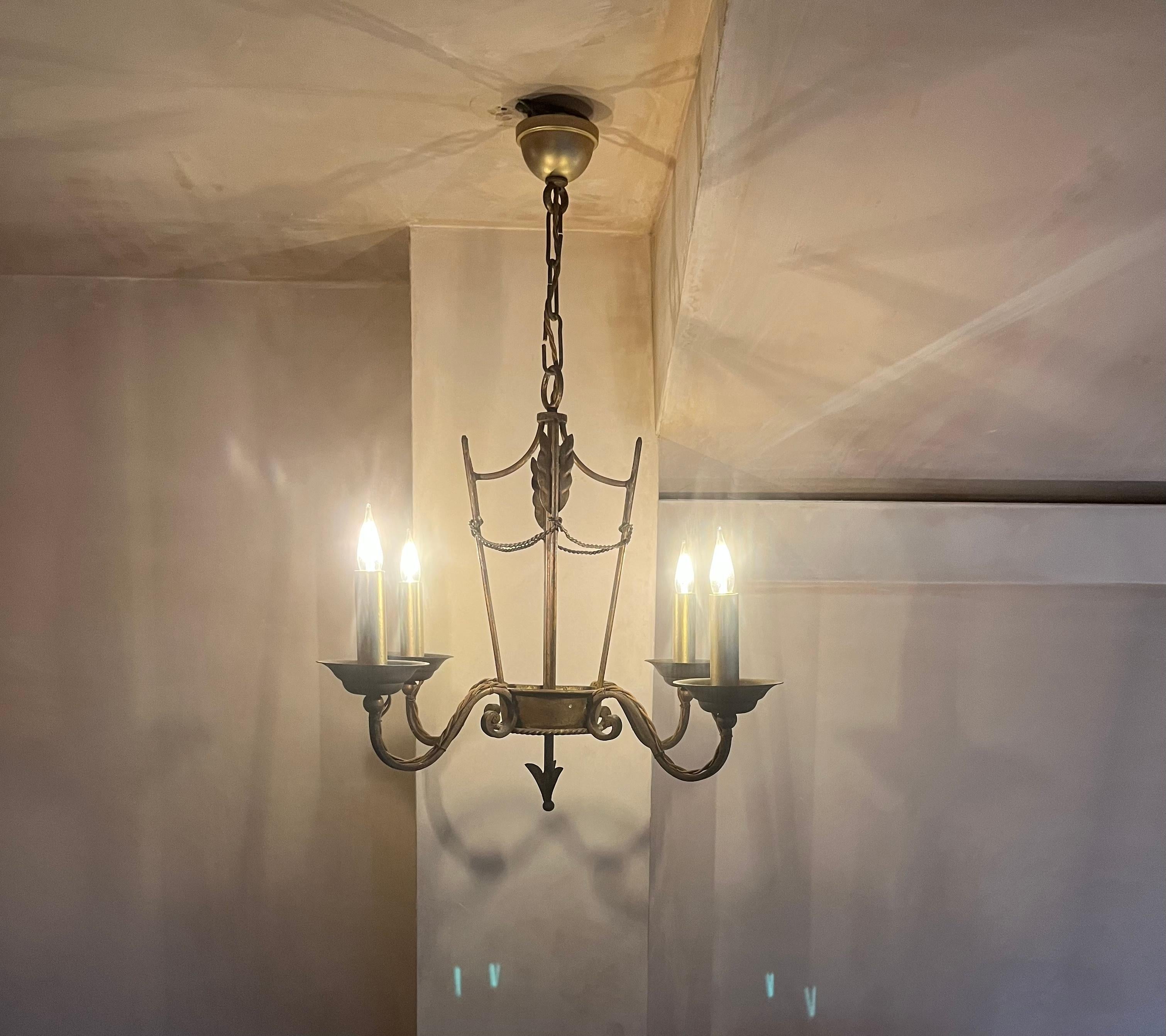Forged French 1940’s gilded iron chandelier For Sale