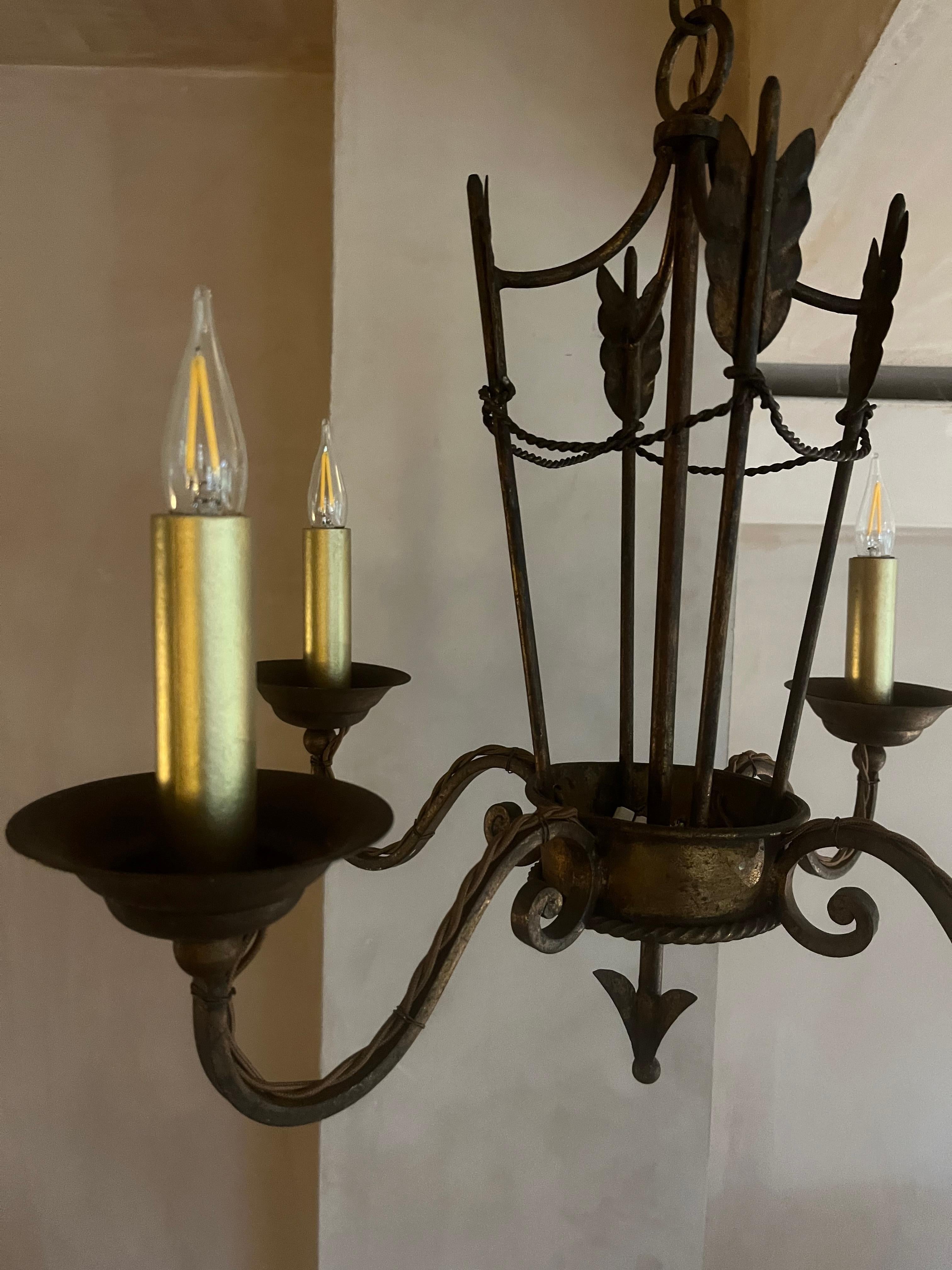 Gold French 1940’s gilded iron chandelier For Sale