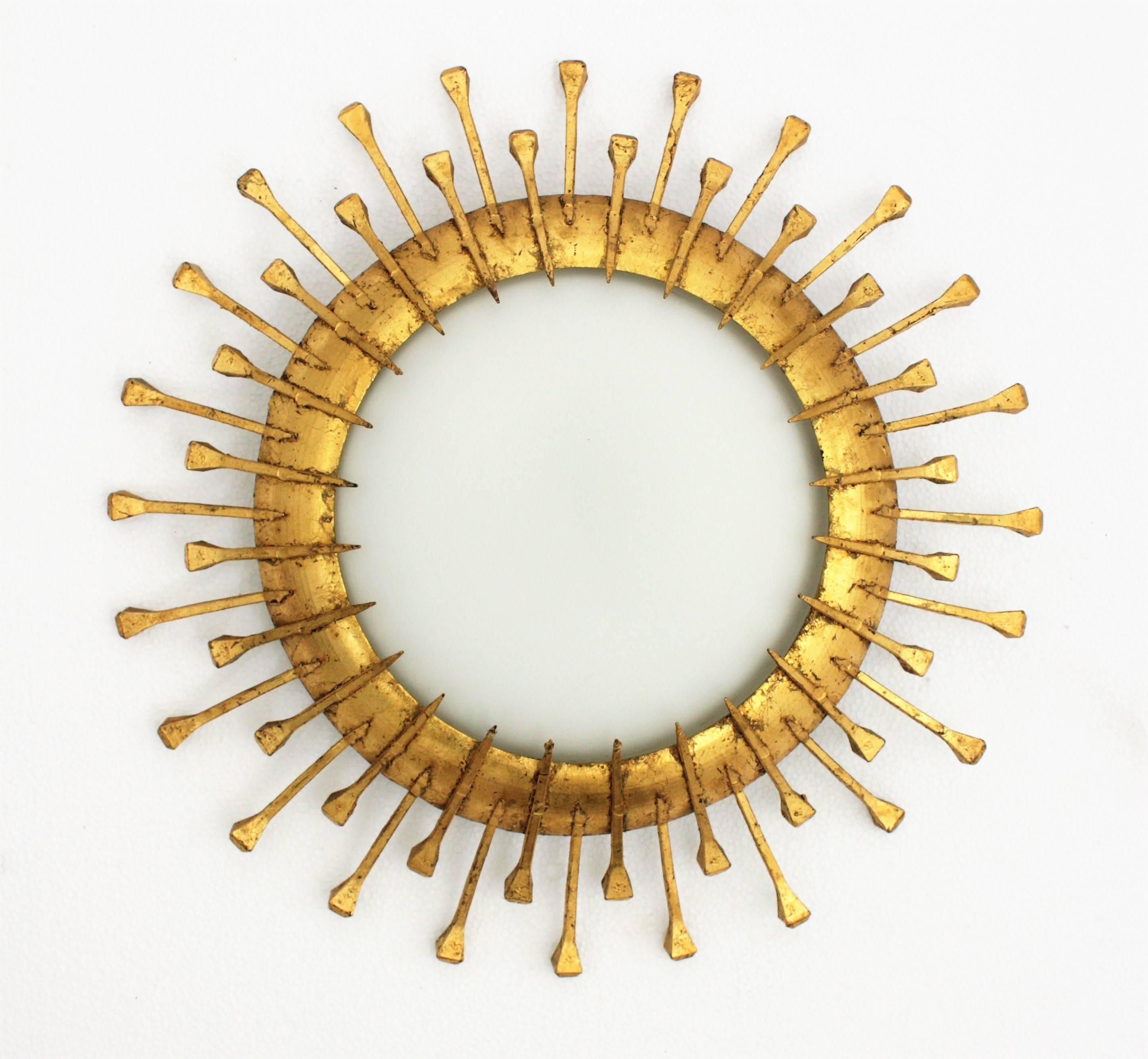 20th Century Two French 1940s Gilt Iron Milk Glass Sunburst Light Fixtures with Nails Details