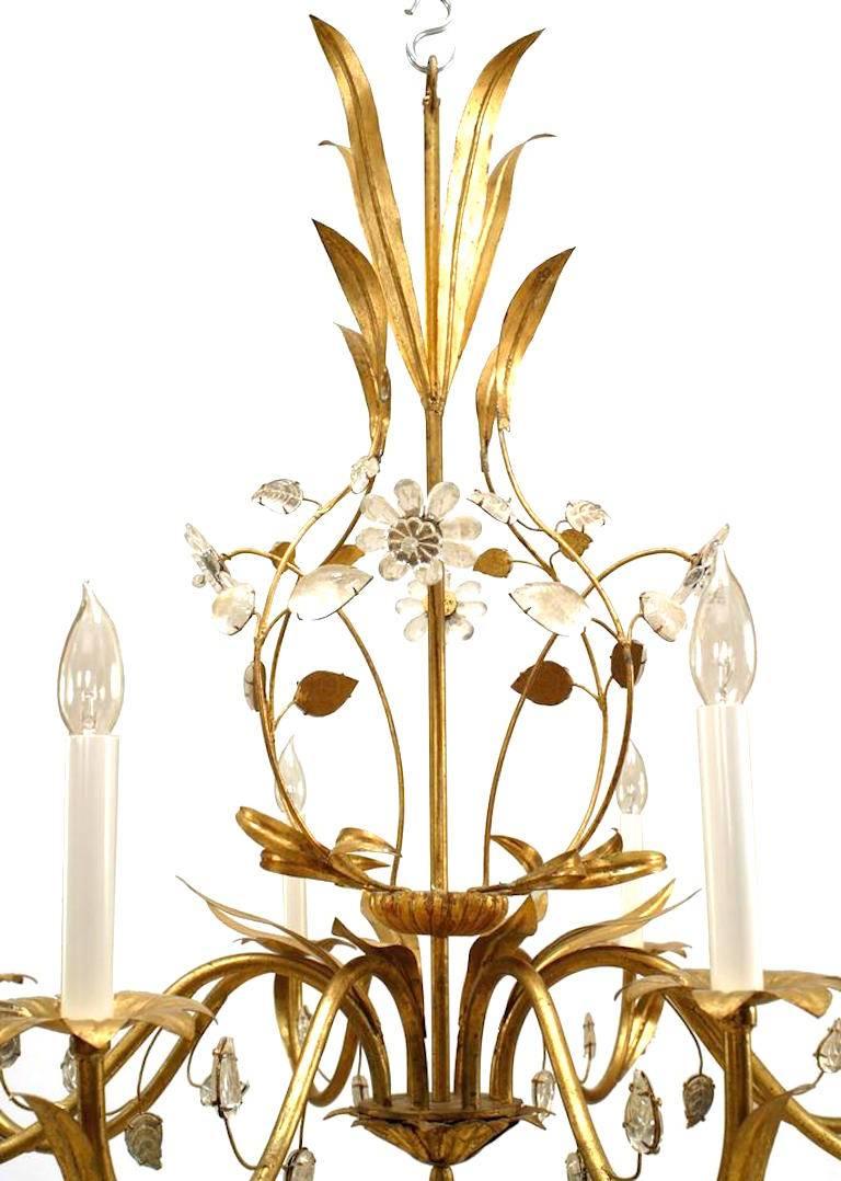 French (1940's) gilt metal chandelier with 8 scroll design arms and gilt metal flowers trimmed with crystal leaves. (BAGUES)
